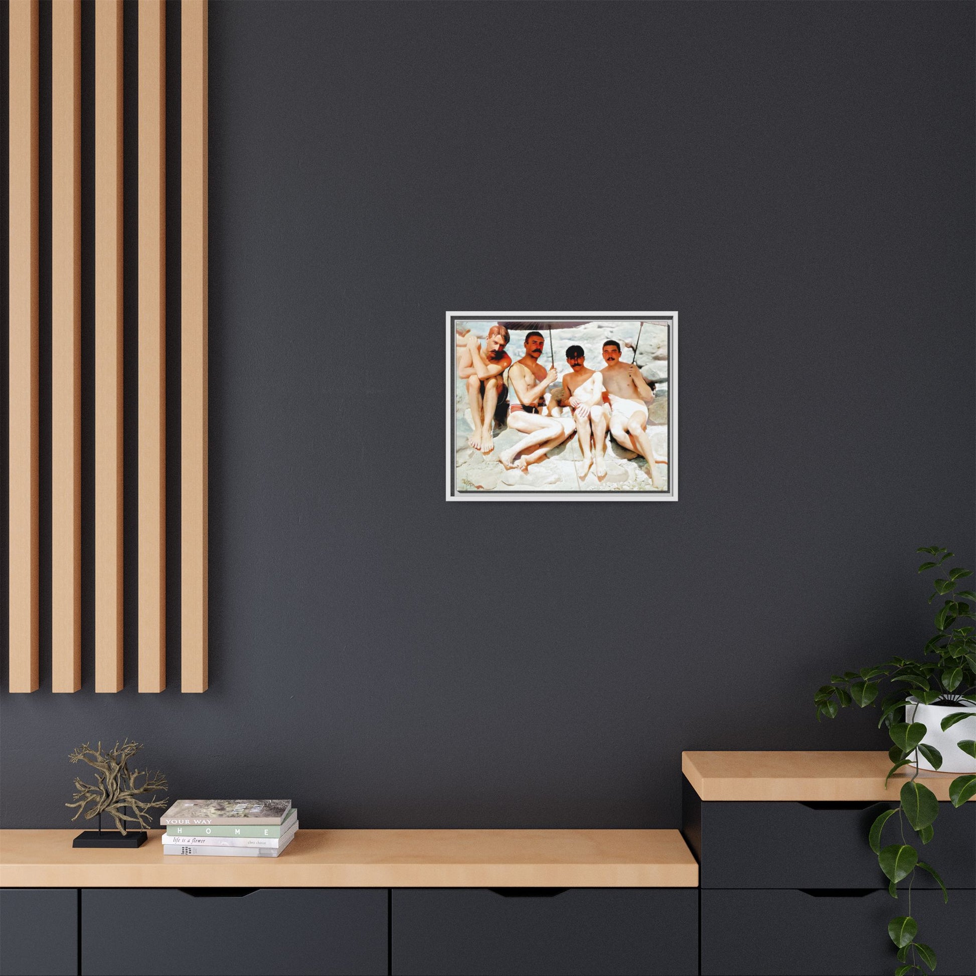 A nostalgic vintage beach photograph from Herring Cove Beach, Provincetown, MA. This framed canvas print captures four men in a relaxed summer moment, perfect for coastal home decor or as an LGBTQ+ history tribute.