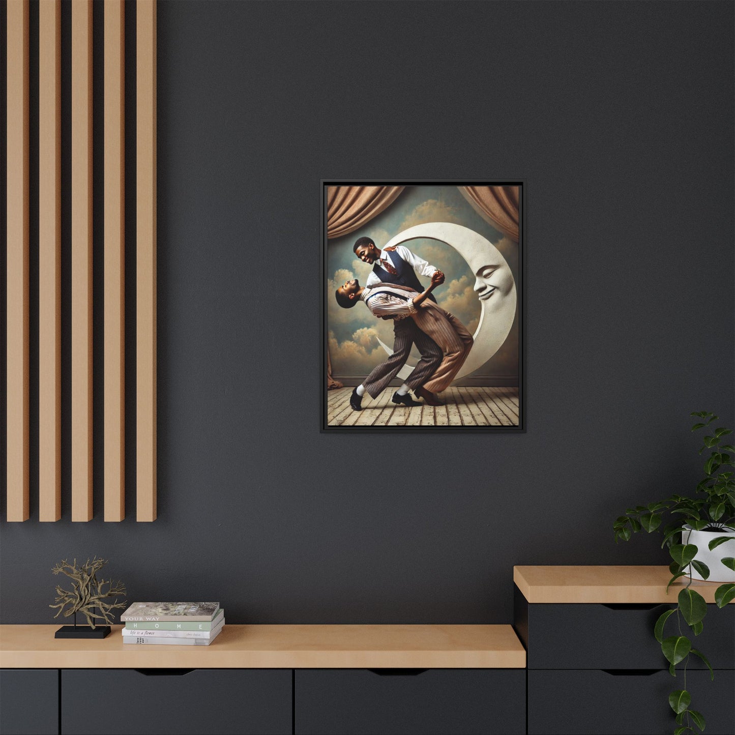 Framed artwork of two Black men in vintage suits dancing tenderly beneath a crescent moon with a smiling face. A romantic 1920s-inspired scene with velvet curtains and a painted sky backdrop. Part of a collection reclaiming lost queer Black history and art.
