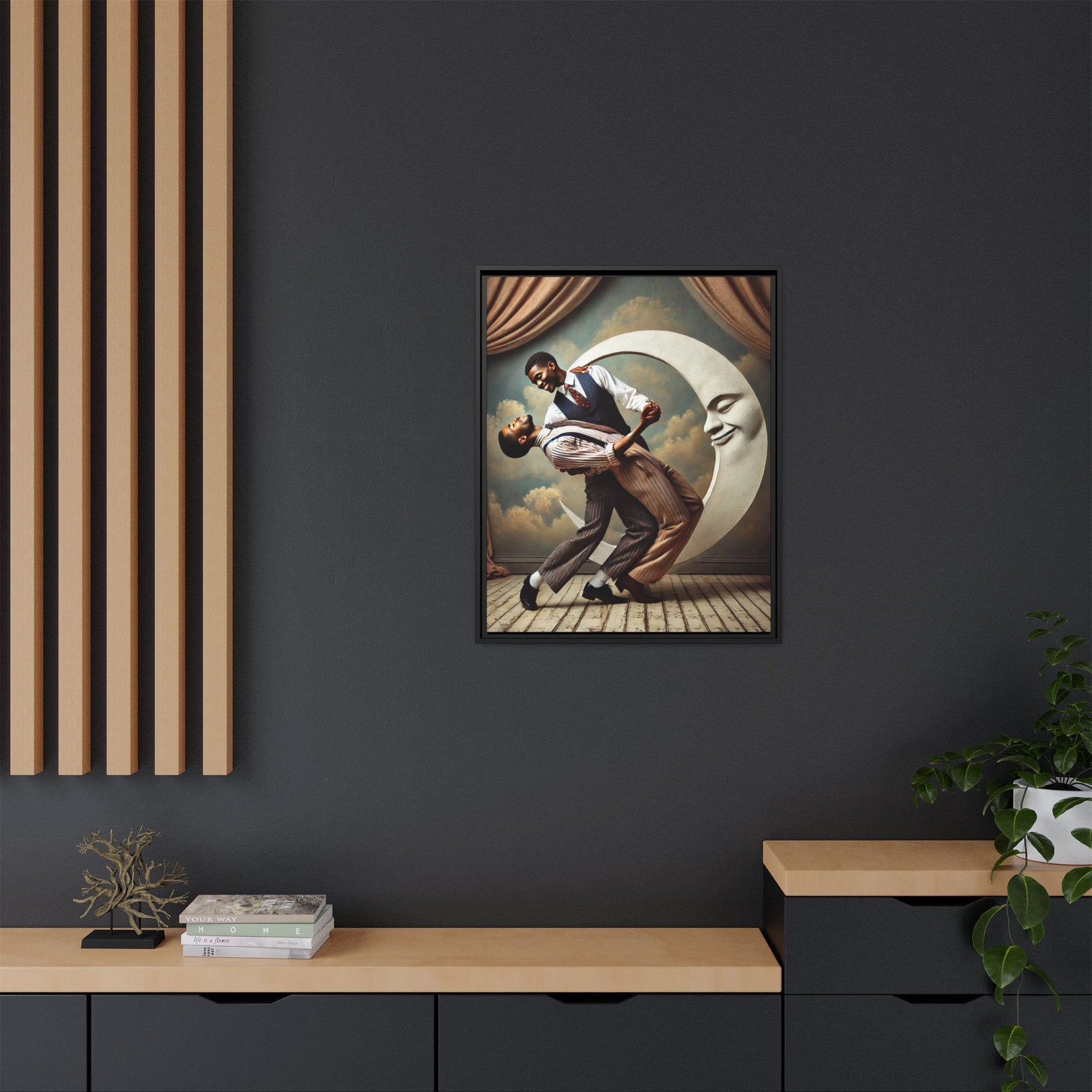 Framed artwork of two Black men in vintage suits dancing tenderly beneath a crescent moon with a smiling face. A romantic 1920s-inspired scene with velvet curtains and a painted sky backdrop. Part of a collection reclaiming lost queer Black history and art.