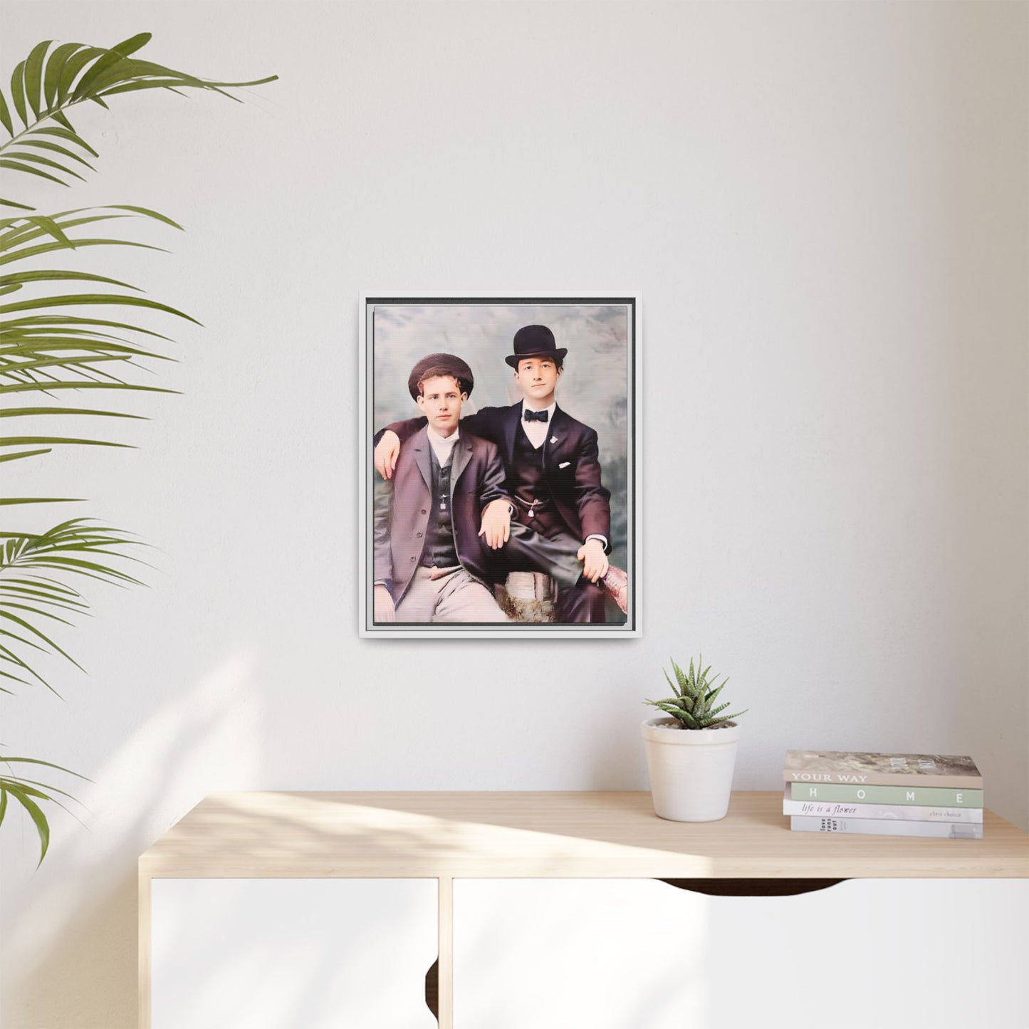 A stunningly restored early 20th-century portrait of Francis and Fai in Santa Barbara, California. Dressed in elegant bowler hats and classic suits, the two men share a poised yet deeply connected moment. The soft pastel tones and refined attire highlight a timeless love story, celebrating LGBTQ+ history and authentic companionship. Gay Couple