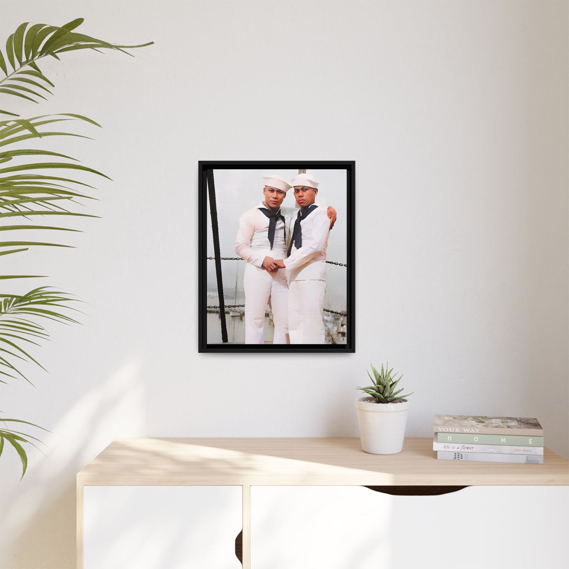 A restored vintage photograph of two Navy sailors standing together aboard a naval ship at Apra Harbor, Guam. Dressed in crisp white uniforms, their hands gently clasped, the image captures a quiet moment of strength, devotion, and LGBTQ+ military history.