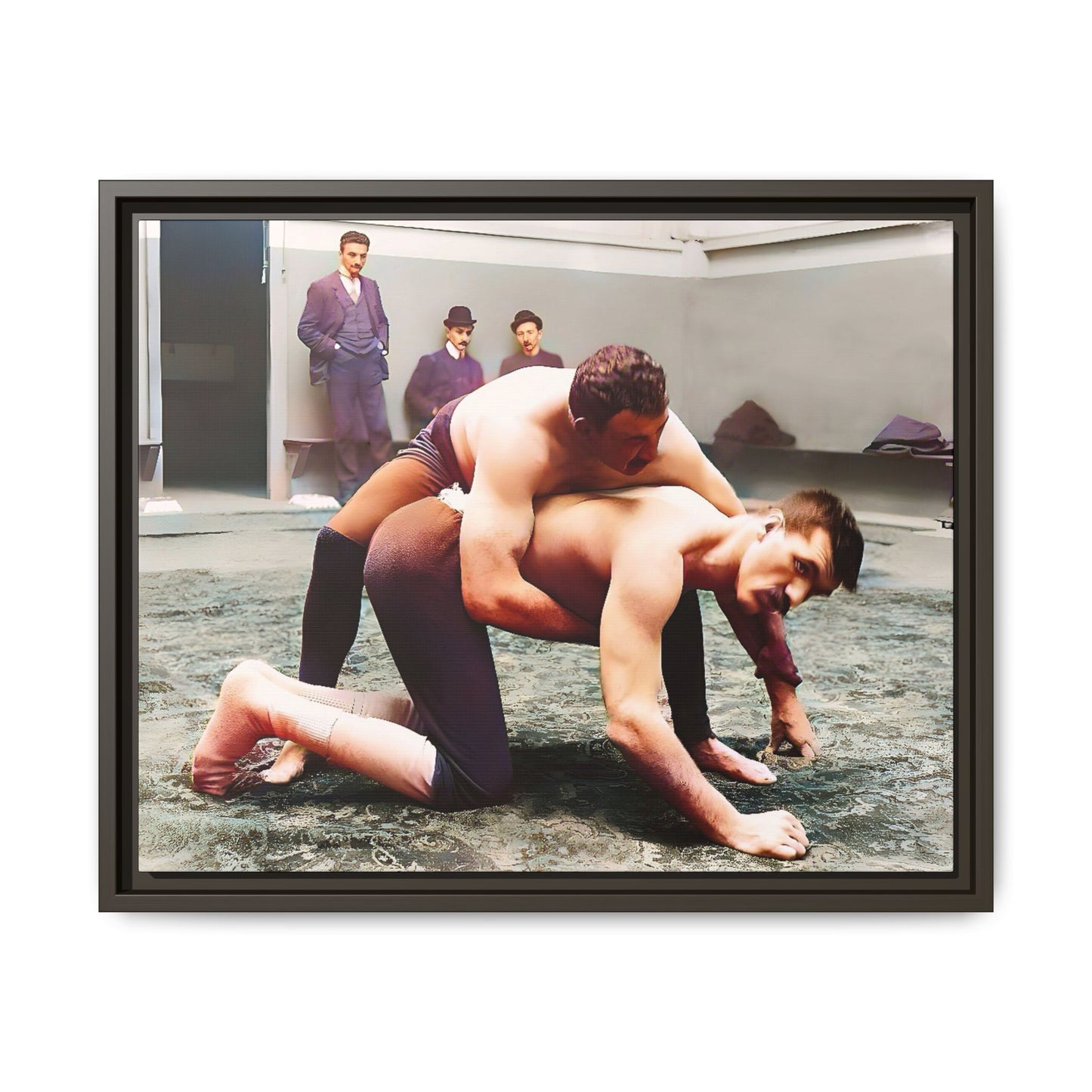 A framed vintage wrestling photograph on matte canvas featuring a Victorian-era match at Love’s Wrestling Club in Plumstead, UK, capturing strength and camaraderie.