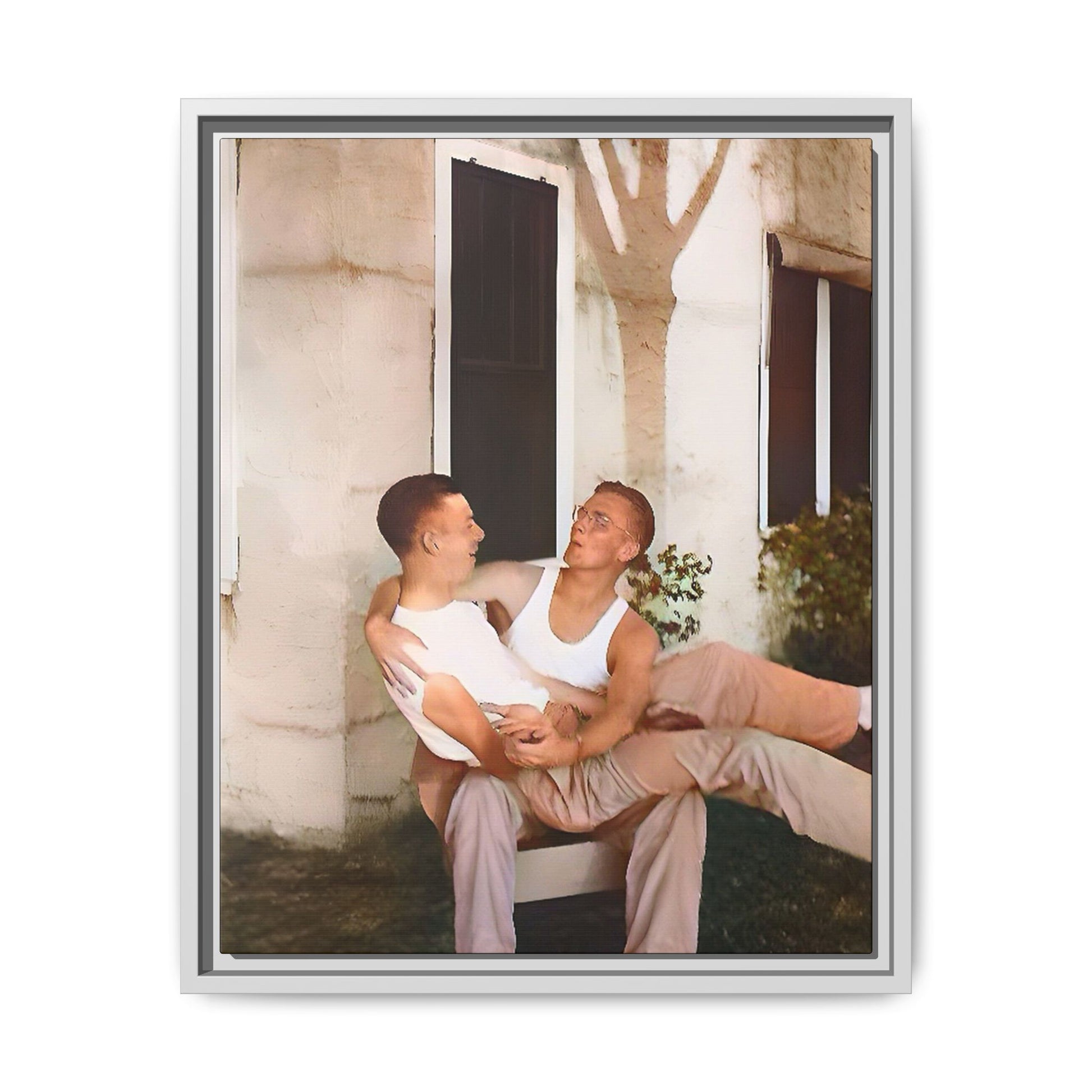 A vintage photograph of Donald and Joseph, two men embracing with joy in 1930s New Orleans. Captured in warm sunlight against a rustic Louisiana home, this intimate portrait celebrates LGBTQ+ history, love, and the beauty of unspoken connection. Gay Couple