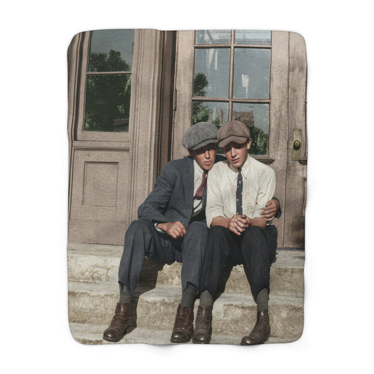 Heirloom sherpa blanket featuring two young men seated together on stone steps
