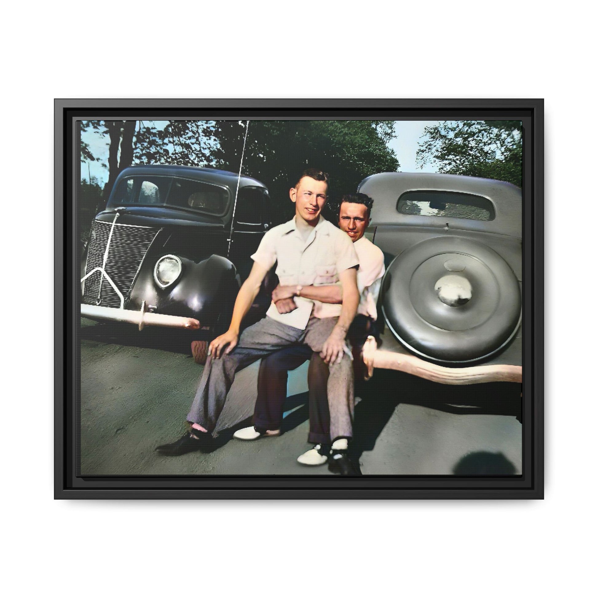 Restored vintage photograph of Andrew and Eugene seated on a classic car bumper in 1930s Lincoln, Nebraska. Framed matte canvas print celebrating LGBTQ+ history, love, and timeless companionship. Gay Couple