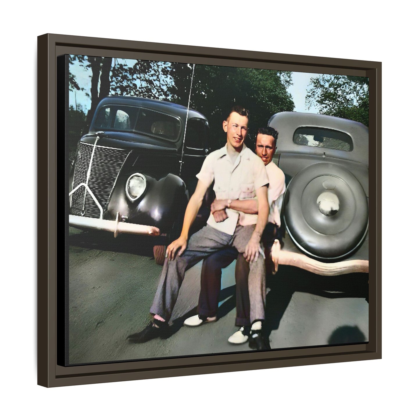 Restored vintage photograph of Andrew and Eugene seated on a classic car bumper in 1930s Lincoln, Nebraska. Framed matte canvas print celebrating LGBTQ+ history, love, and timeless companionship. Gay Couple