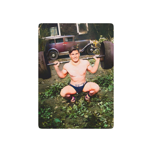 Vintage photo of a shirtless weightlifter balancing a barbell, showcasing early fitness culture and Queer resilience.