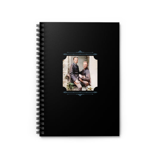 Black spiral notebook featuring a restored studio portrait of two men in suits posed affectionately together