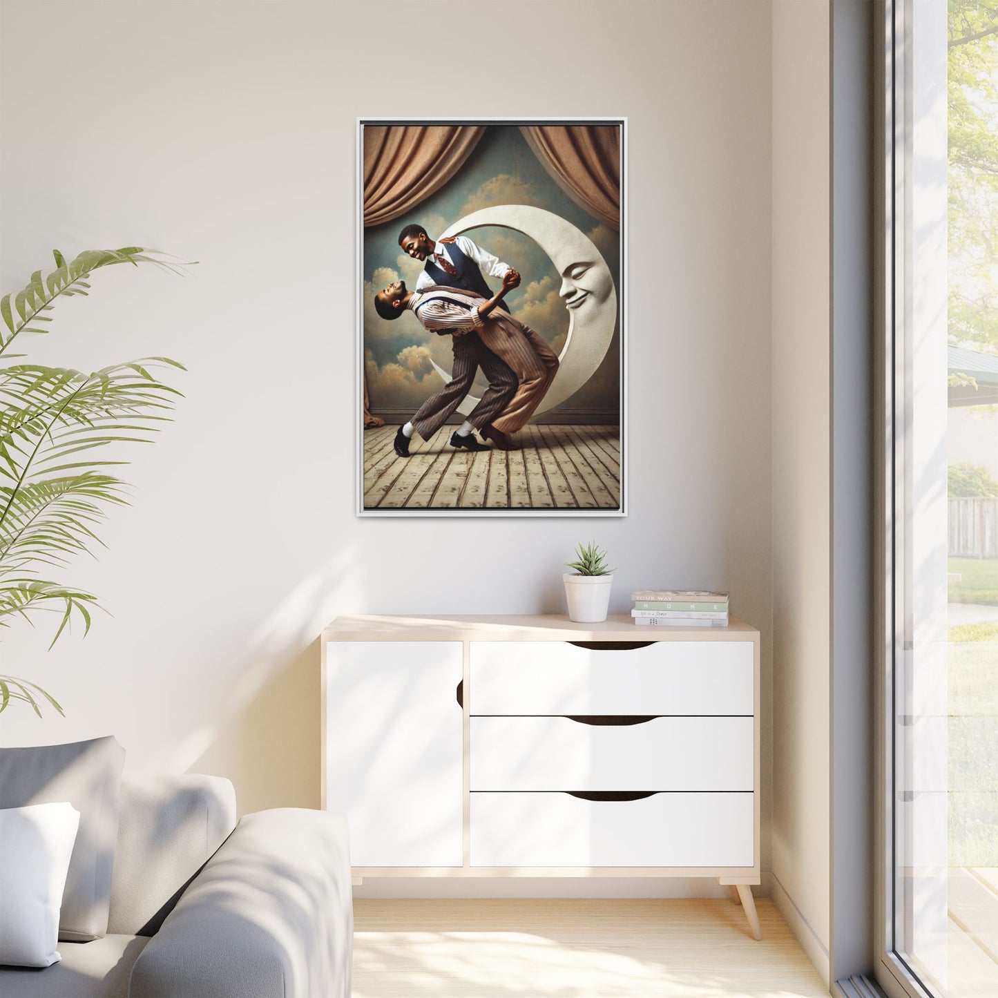 Framed artwork of two Black men in vintage suits dancing tenderly beneath a crescent moon with a smiling face. A romantic 1920s-inspired scene with velvet curtains and a painted sky backdrop. Part of a collection reclaiming lost queer Black history and art.