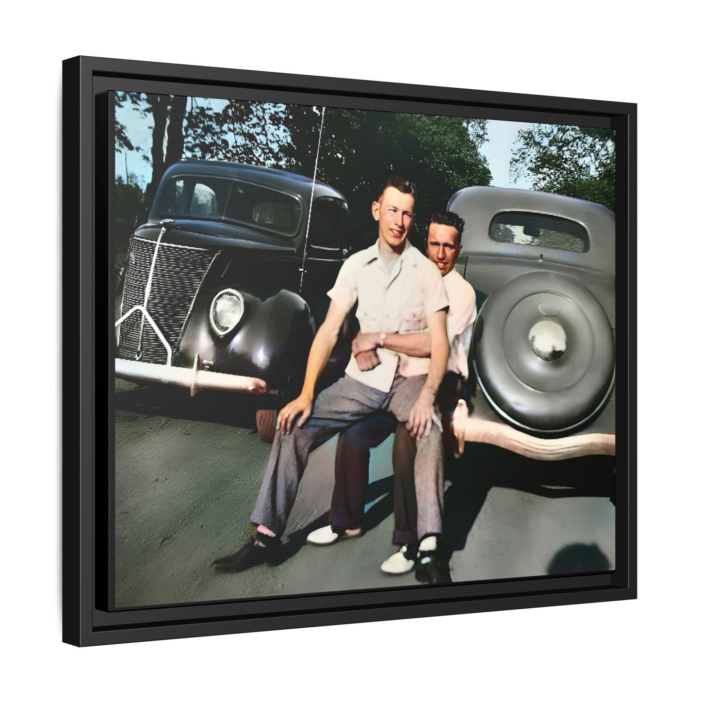 Restored vintage photograph of Andrew and Eugene seated on a classic car bumper in 1930s Lincoln, Nebraska. Framed matte canvas print celebrating LGBTQ+ history, love, and timeless companionship. Gay Couple