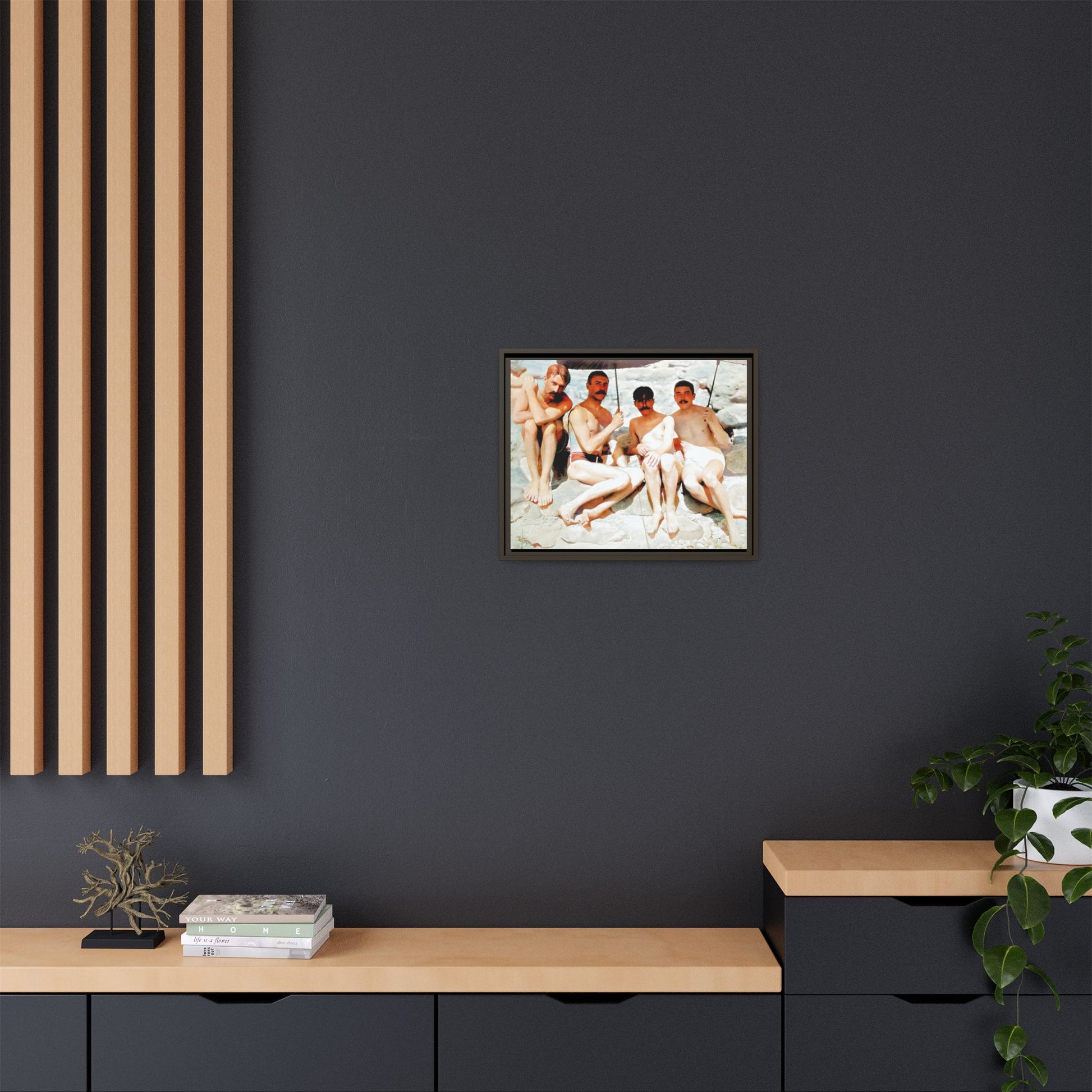 A nostalgic vintage beach photograph from Herring Cove Beach, Provincetown, MA. This framed canvas print captures four men in a relaxed summer moment, perfect for coastal home decor or as an LGBTQ+ history tribute.