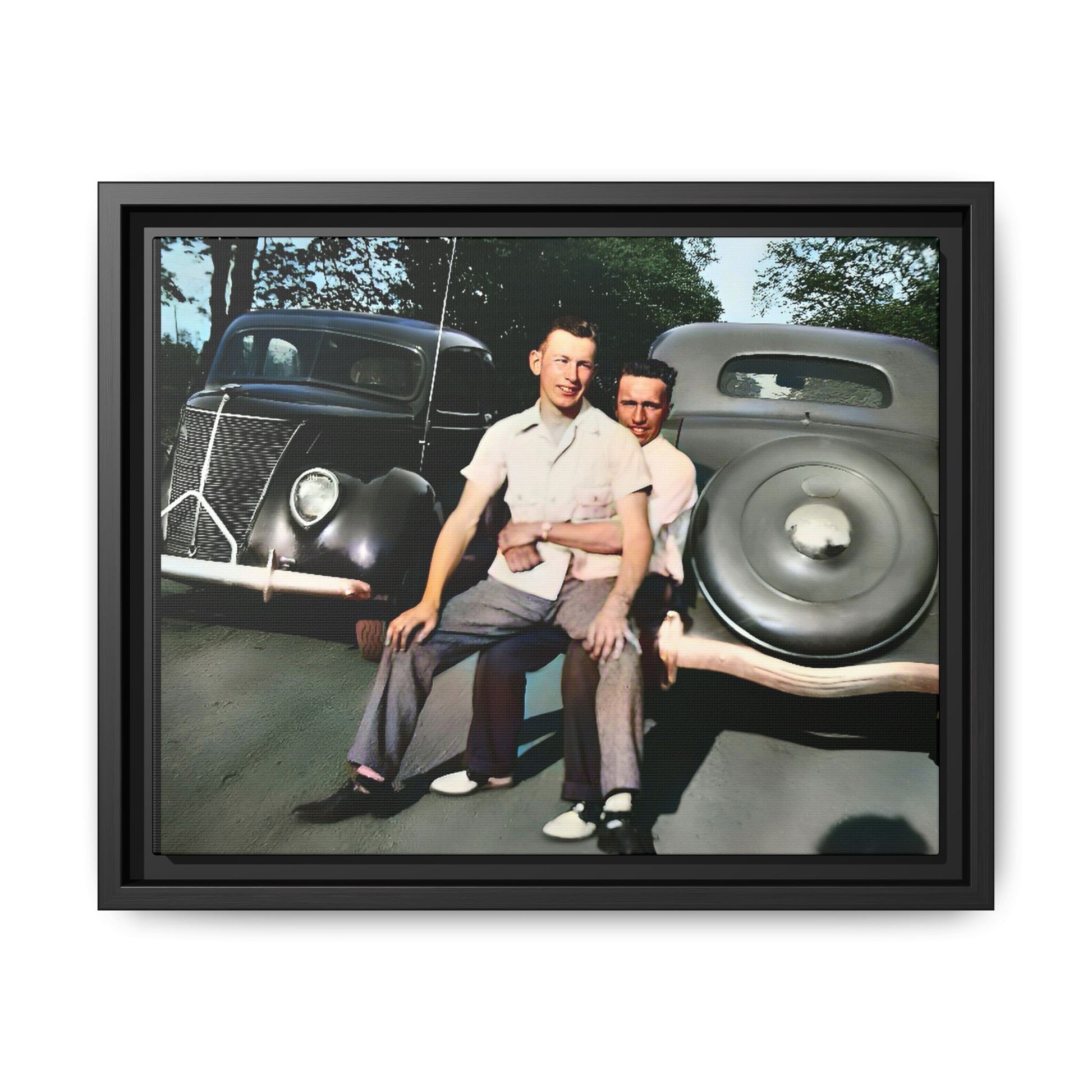 Restored vintage photograph of Andrew and Eugene seated on a classic car bumper in 1930s Lincoln, Nebraska. Framed matte canvas print celebrating LGBTQ+ history, love, and timeless companionship. Gay Couple