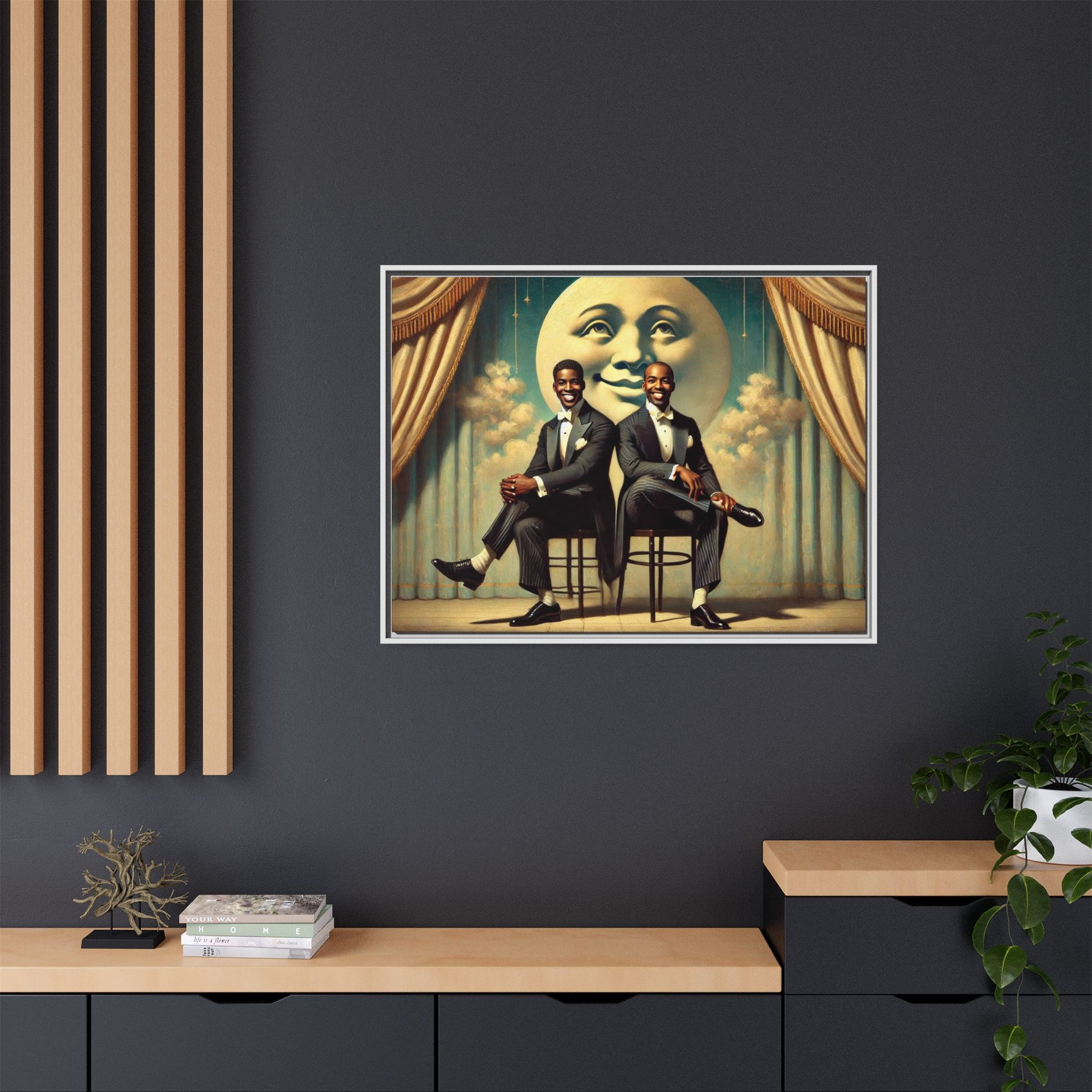 Framed vintage-style portrait of two Black men in tuxedos seated under a smiling crescent moon prop with golden curtains and cloud backdrop. This restored matte canvas honors lost LGBTQ history and reclaims early 20th-century queer representation with pride.