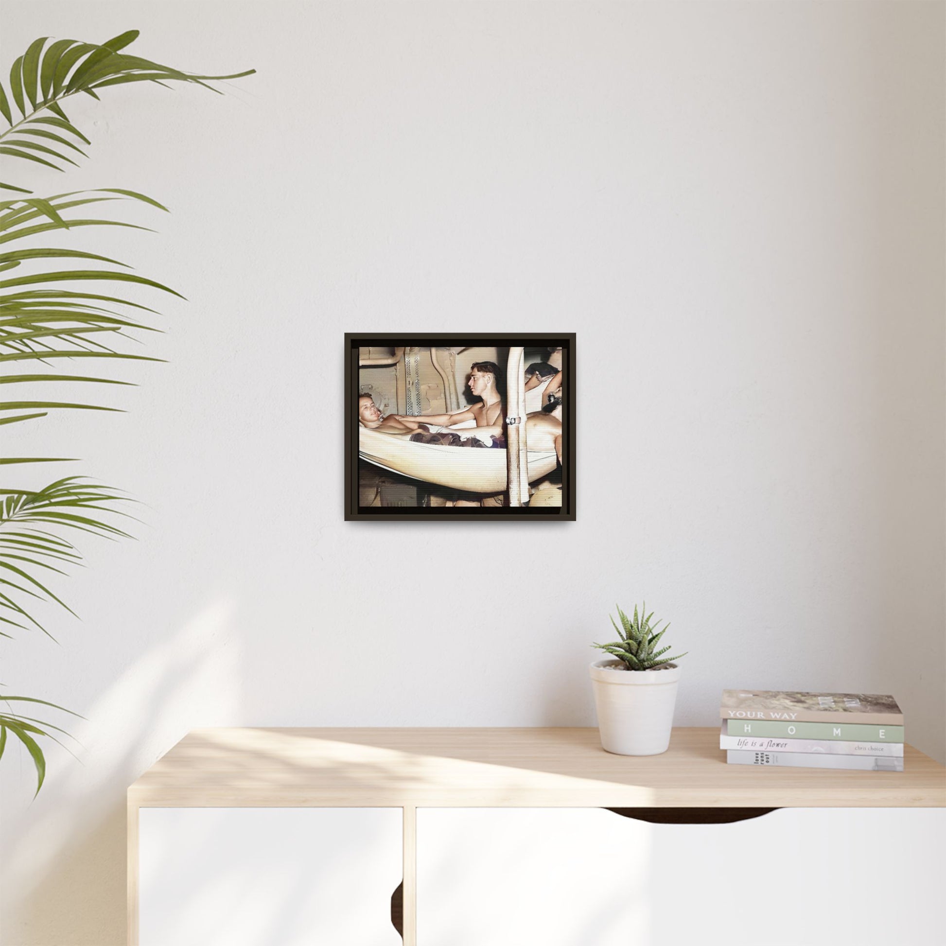 A framed vintage maritime photo on matte canvas featuring sailors aboard the Orleans, capturing life at sea and camaraderie.