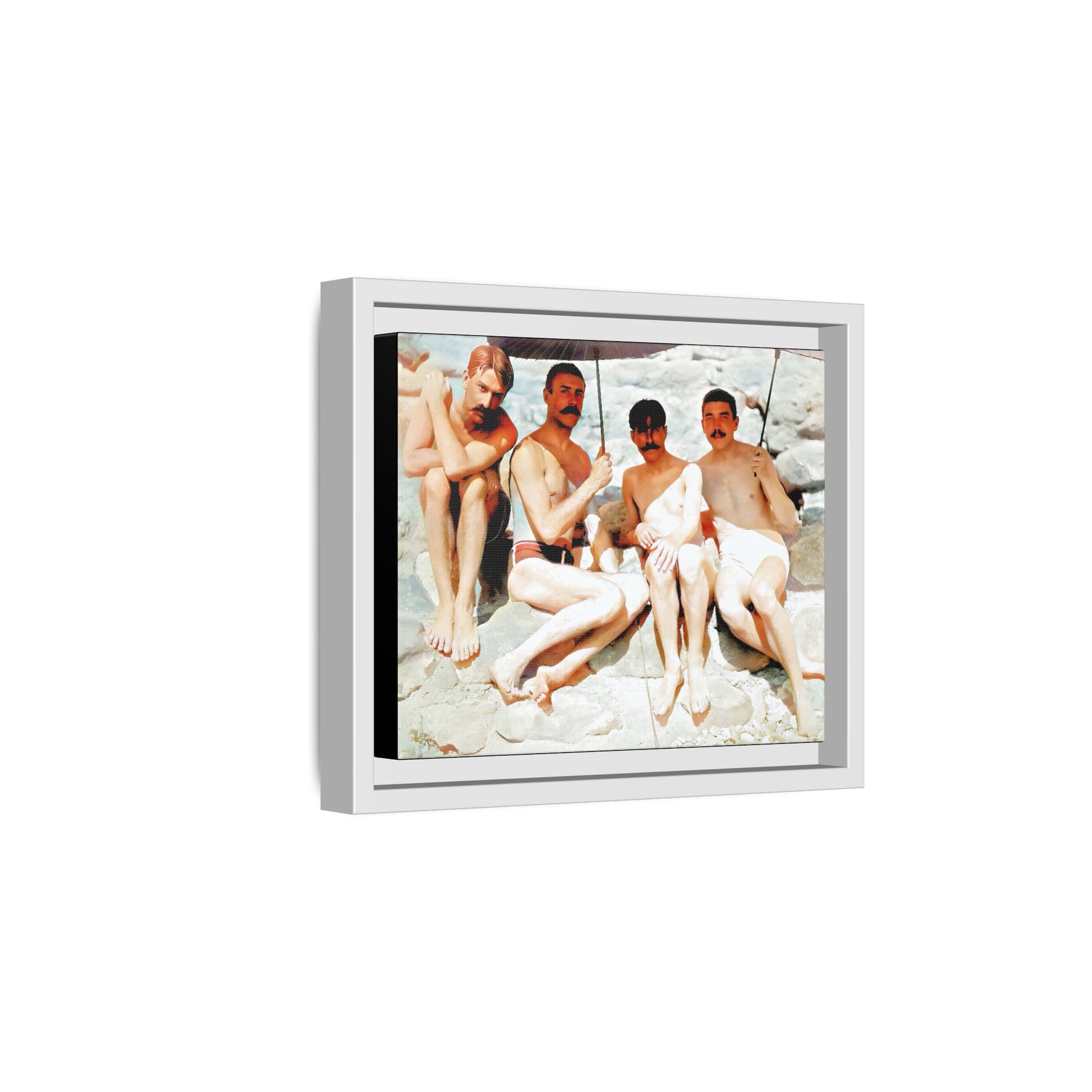 A nostalgic vintage beach photograph from Herring Cove Beach, Provincetown, MA. This framed canvas print captures four men in a relaxed summer moment, perfect for coastal home decor or as an LGBTQ+ history tribute.