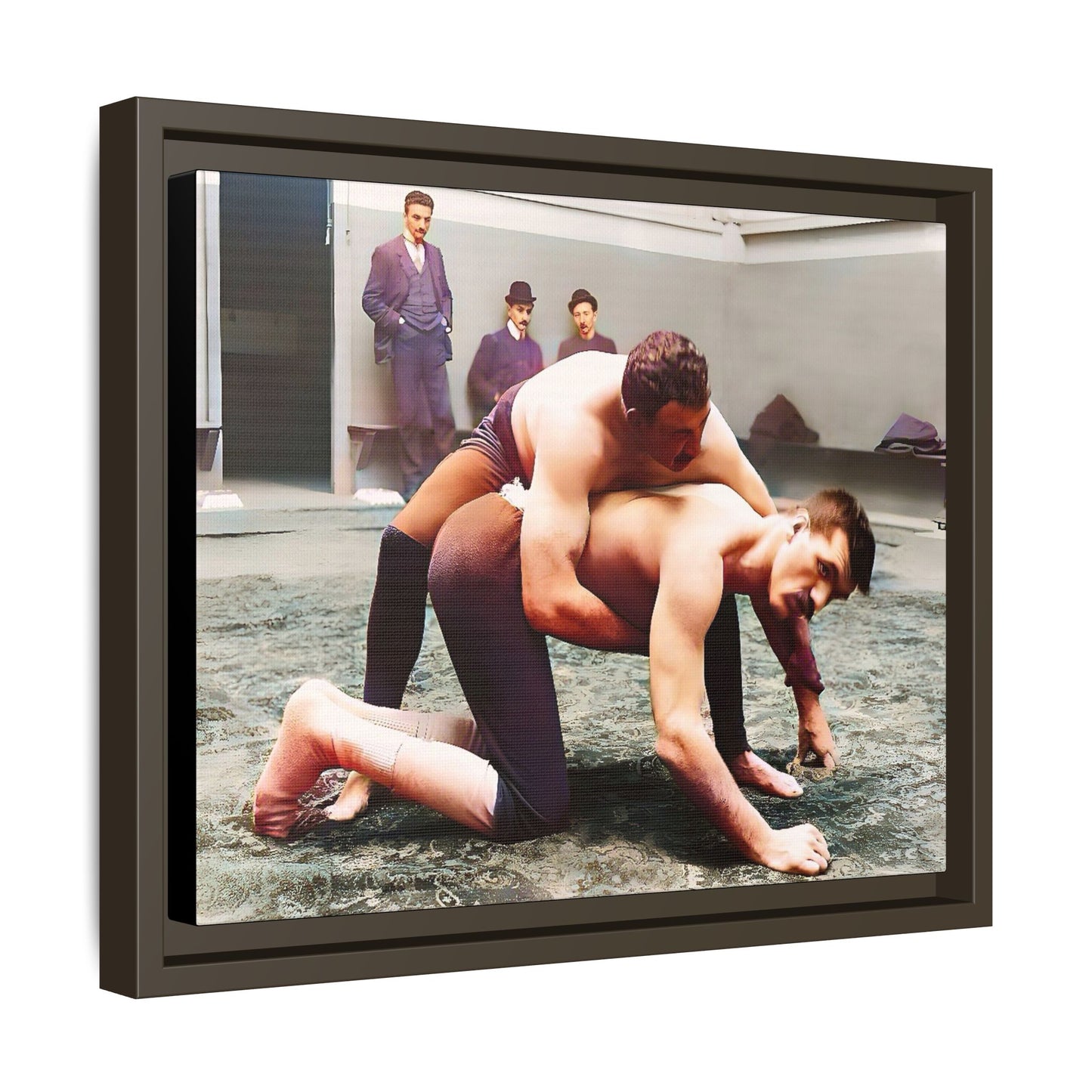 A framed vintage wrestling photograph on matte canvas featuring a Victorian-era match at Love’s Wrestling Club in Plumstead, UK, capturing strength and camaraderie.