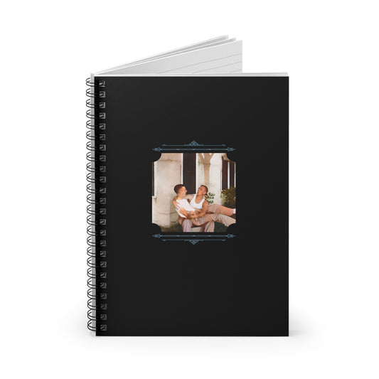 Spiral notebook featuring a vintage photo of a joyful gay couple lounging together on a porch in the 1940s.