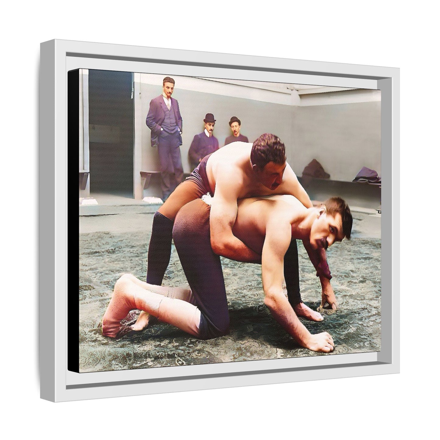 A framed vintage wrestling photograph on matte canvas featuring a Victorian-era match at Love’s Wrestling Club in Plumstead, UK, capturing strength and camaraderie.