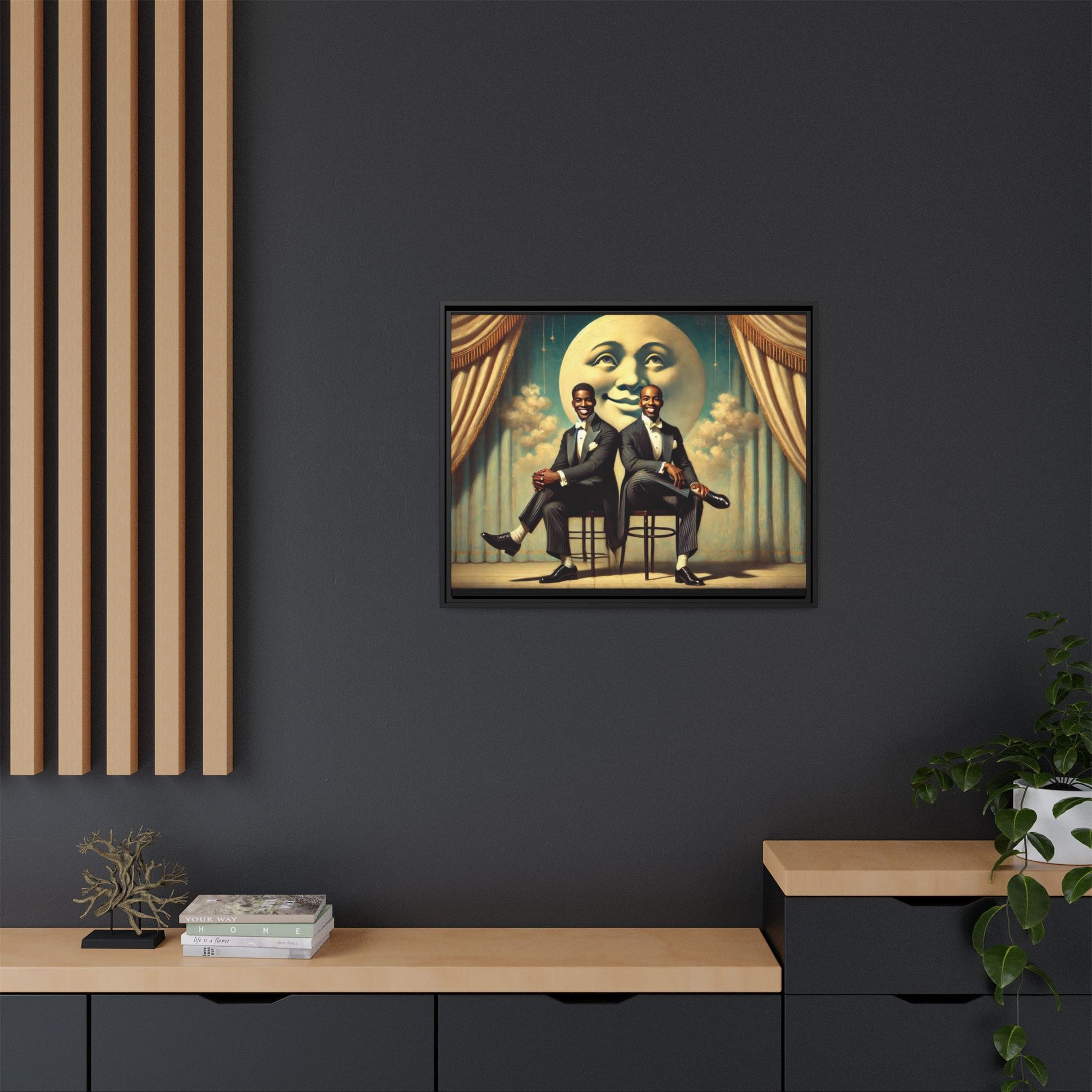 Framed vintage-style portrait of two Black men in tuxedos seated under a smiling crescent moon prop with golden curtains and cloud backdrop. This restored matte canvas honors lost LGBTQ history and reclaims early 20th-century queer representation with pride.