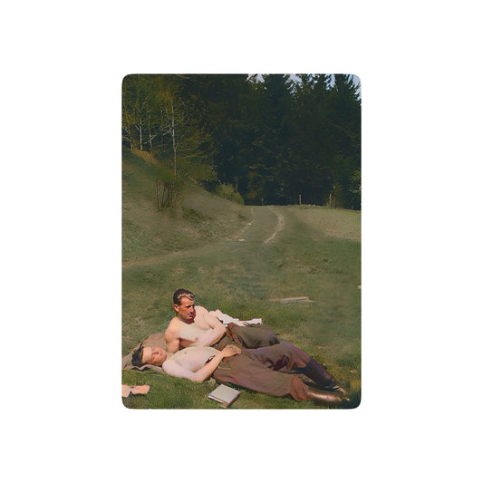 Vintage WWII photo of two soldiers reclining together on a hillside, symbolizing Queer love and resilience during wartime.
