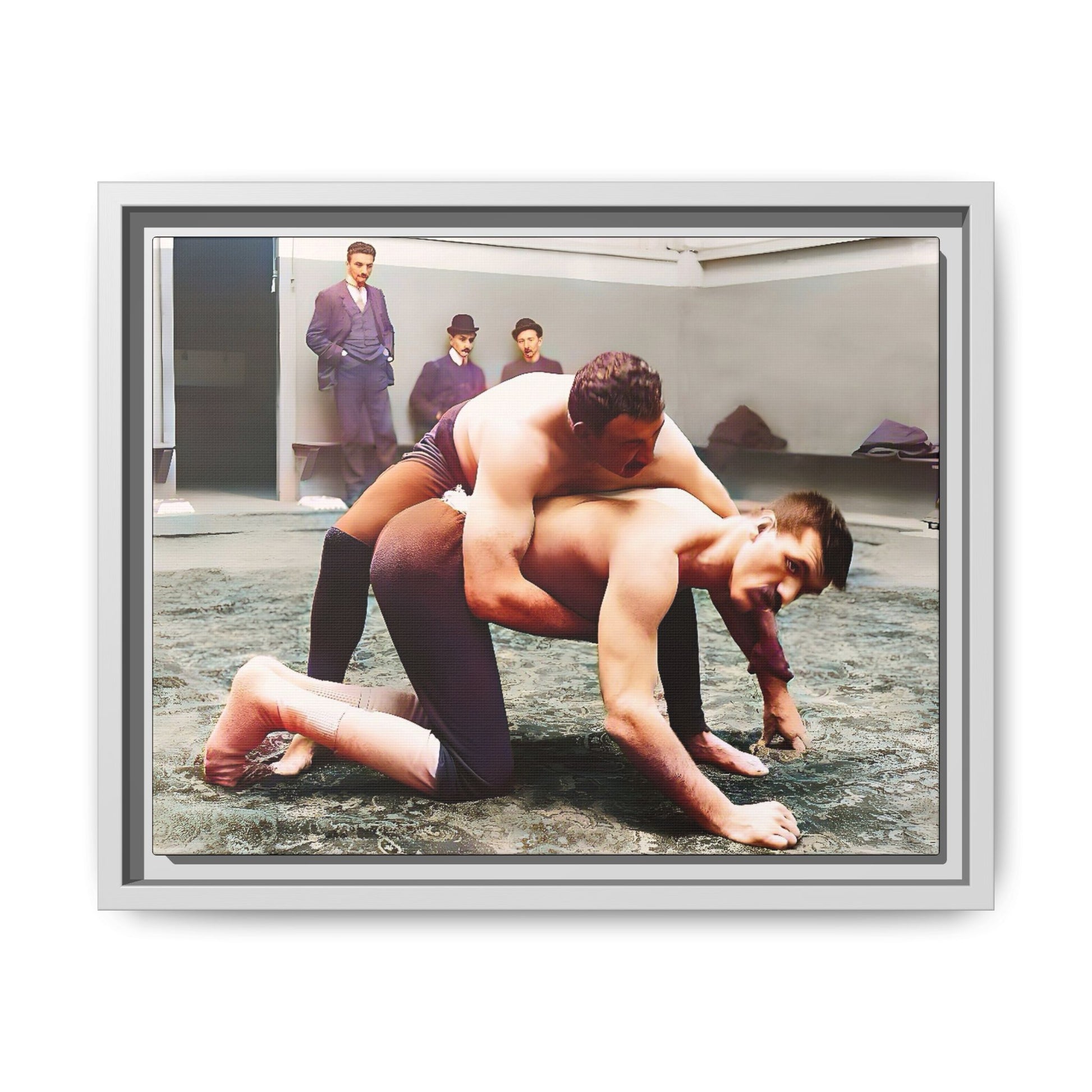 A framed vintage wrestling photograph on matte canvas featuring a Victorian-era match at Love’s Wrestling Club in Plumstead, UK, capturing strength and camaraderie.