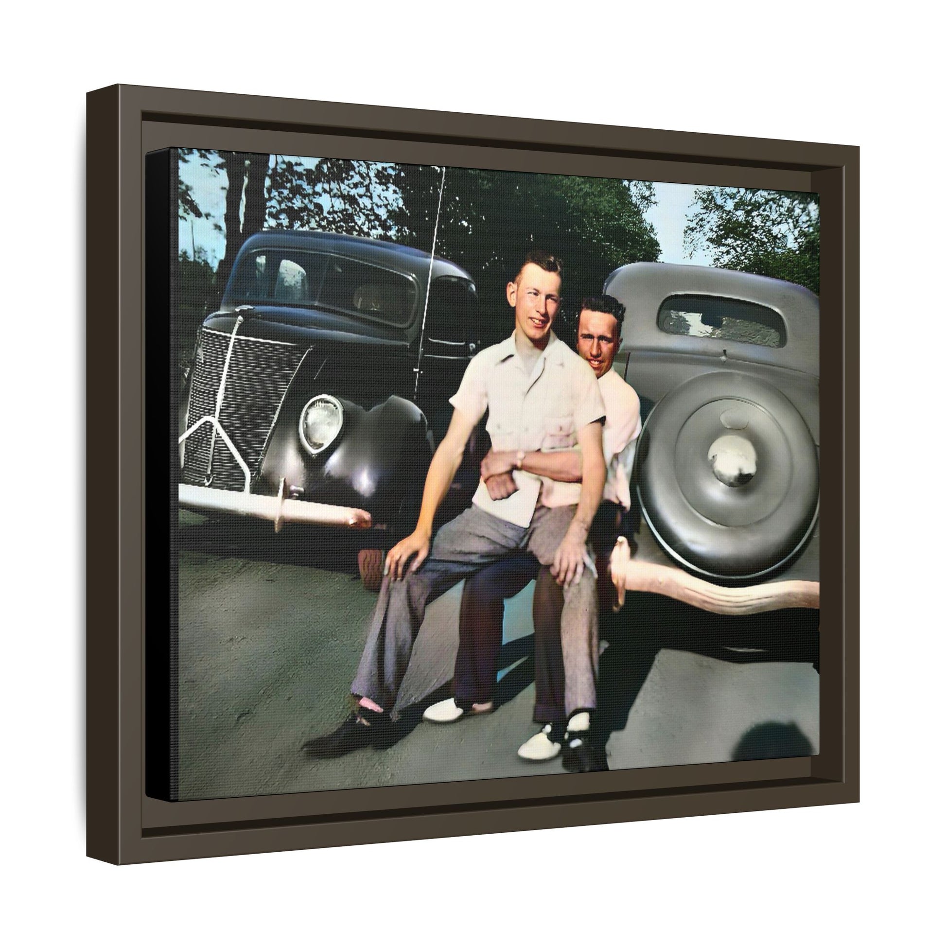 Restored vintage photograph of Andrew and Eugene seated on a classic car bumper in 1930s Lincoln, Nebraska. Framed matte canvas print celebrating LGBTQ+ history, love, and timeless companionship. Gay Couple