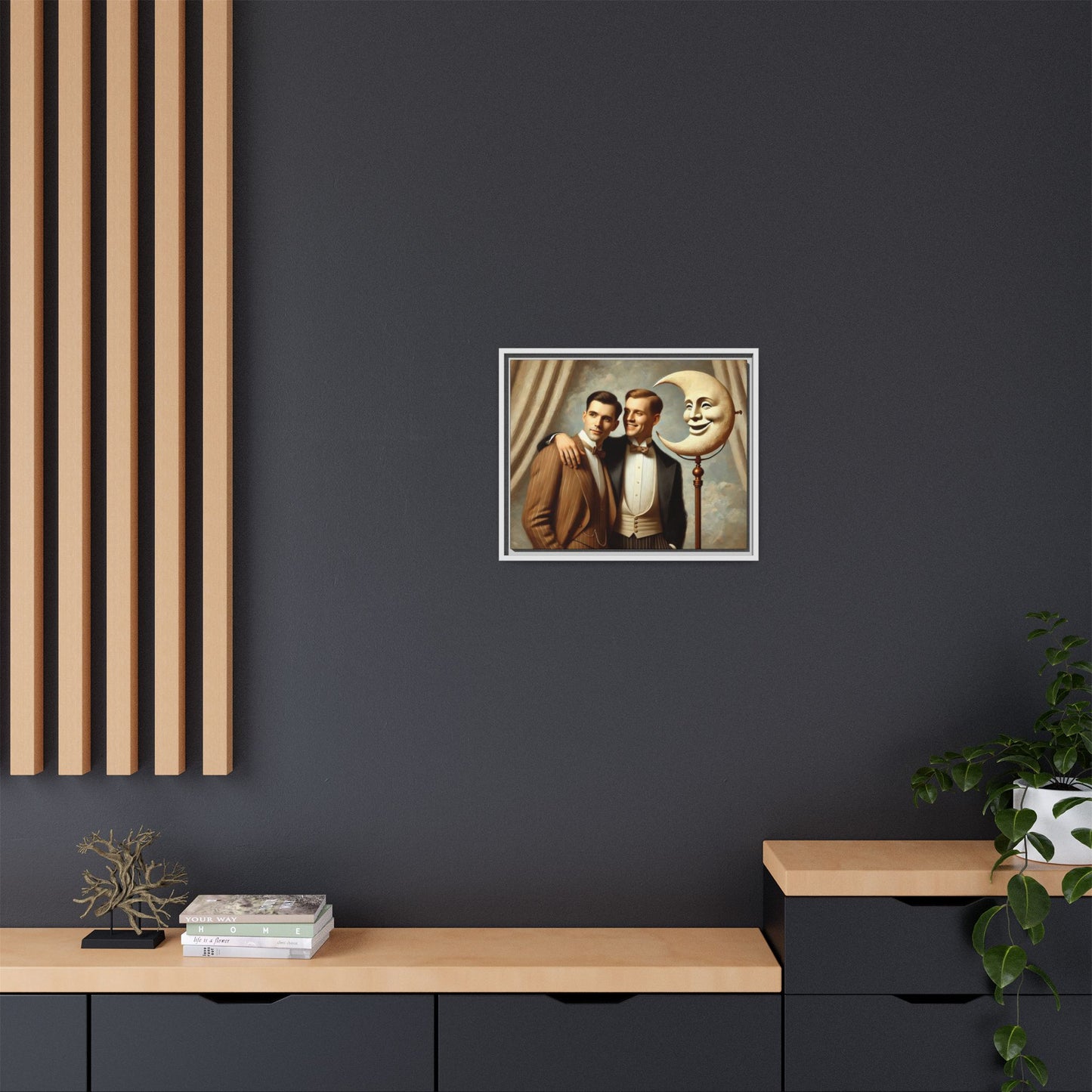 Framed matte canvas artwork of two men in vintage tuxedos standing beside a crescent moon prop. This piece reclaims LGBTQ+ representation lost to bias and honors everyday moments of affection and connection once absent from historical archives.