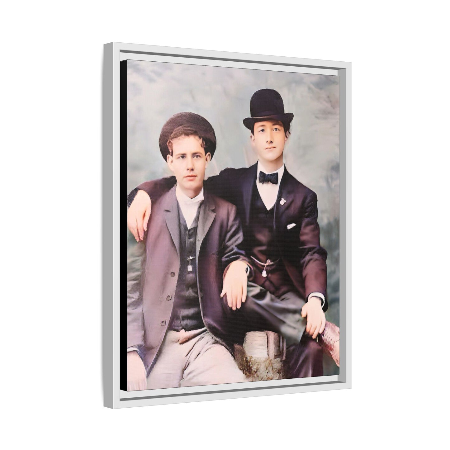 A stunningly restored early 20th-century portrait of Francis and Fai in Santa Barbara, California. Dressed in elegant bowler hats and classic suits, the two men share a poised yet deeply connected moment. The soft pastel tones and refined attire highlight a timeless love story, celebrating LGBTQ+ history and authentic companionship. Gay Couple