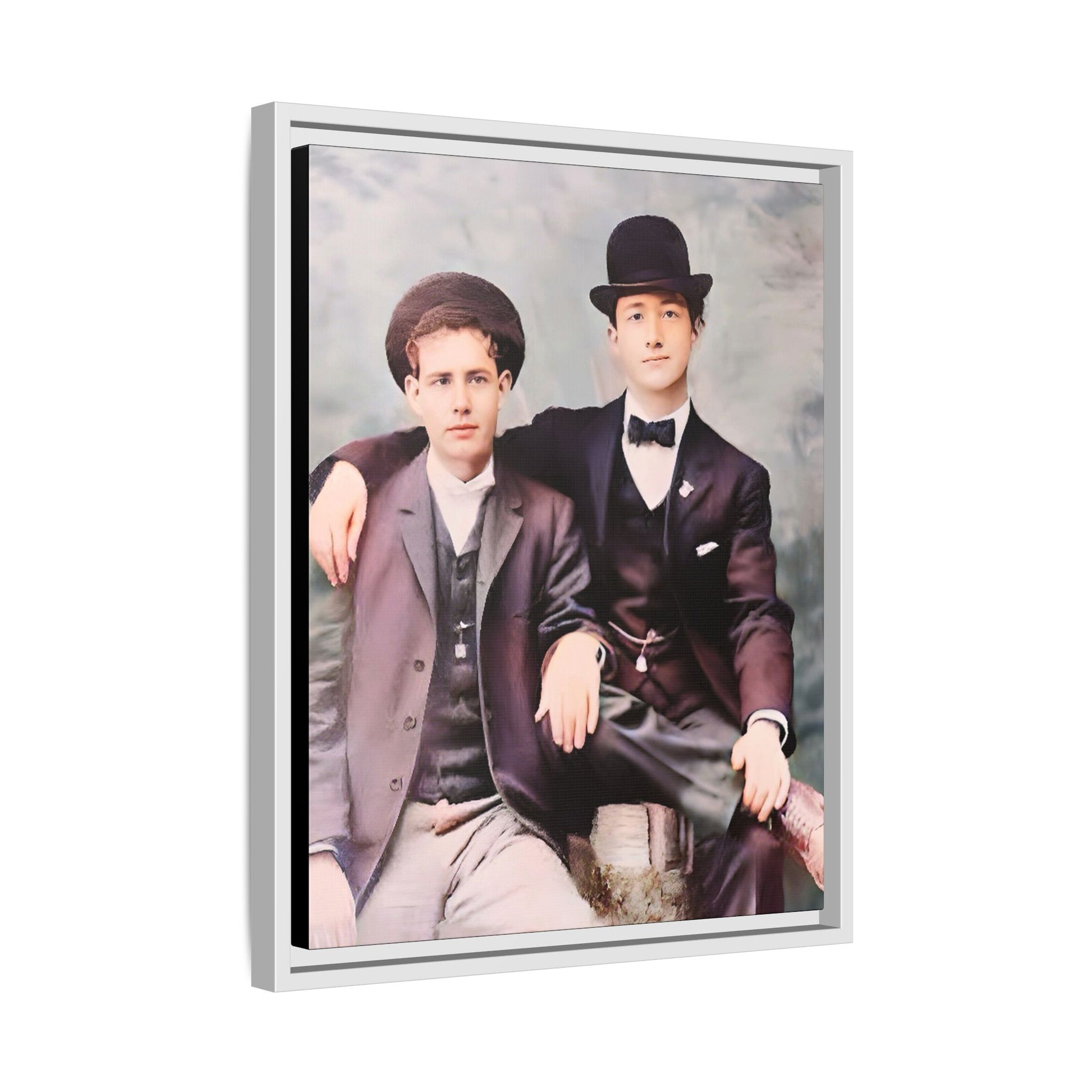 A stunningly restored early 20th-century portrait of Francis and Fai in Santa Barbara, California. Dressed in elegant bowler hats and classic suits, the two men share a poised yet deeply connected moment. The soft pastel tones and refined attire highlight a timeless love story, celebrating LGBTQ+ history and authentic companionship. Gay Couple