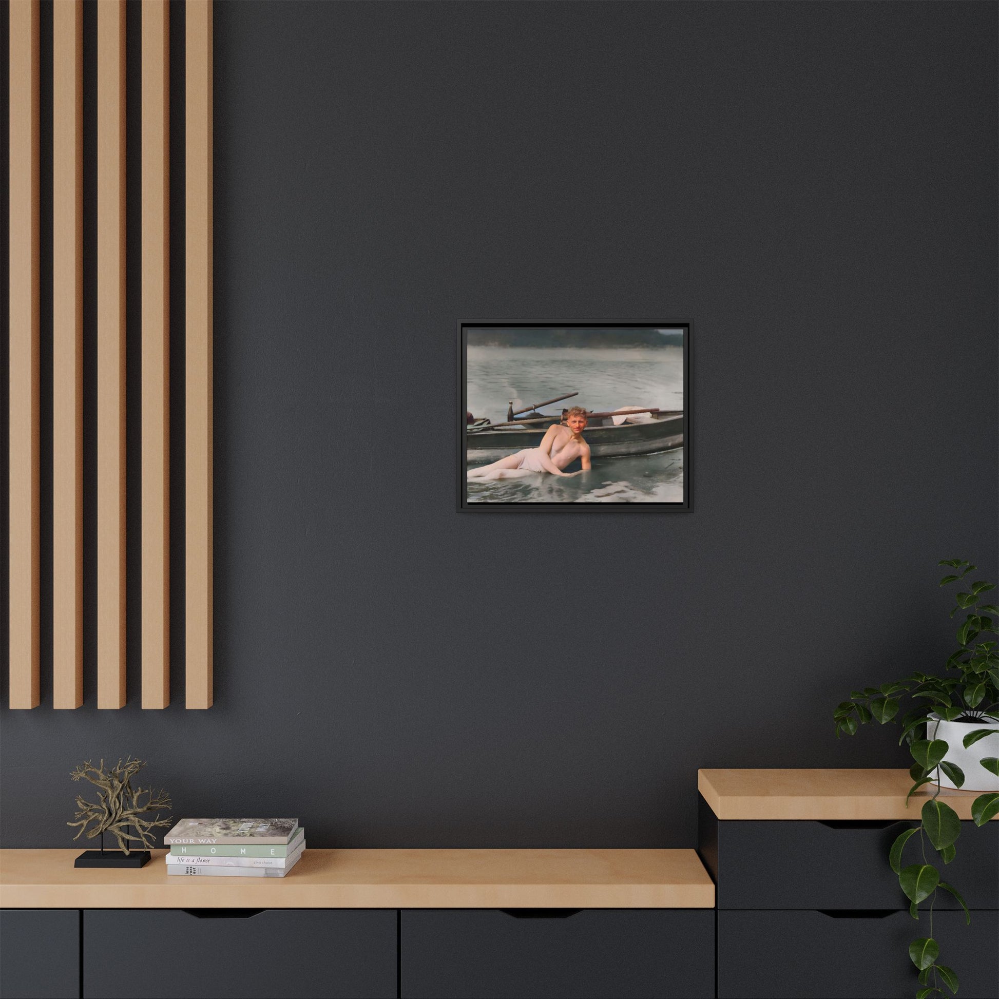Restored vintage photo of Claude reclining by a rowboat on a calm lake in early 1900s Green Bay, Wisconsin. Framed matte canvas art celebrating serenity, history, and individuality.