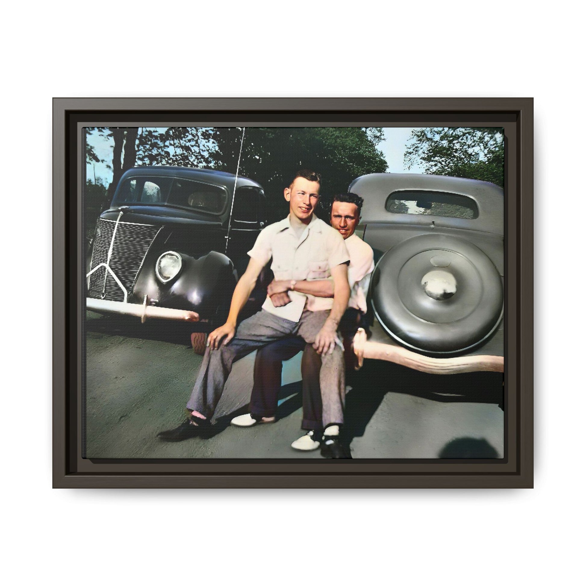 Restored vintage photograph of Andrew and Eugene seated on a classic car bumper in 1930s Lincoln, Nebraska. Framed matte canvas print celebrating LGBTQ+ history, love, and timeless companionship. Gay Couple