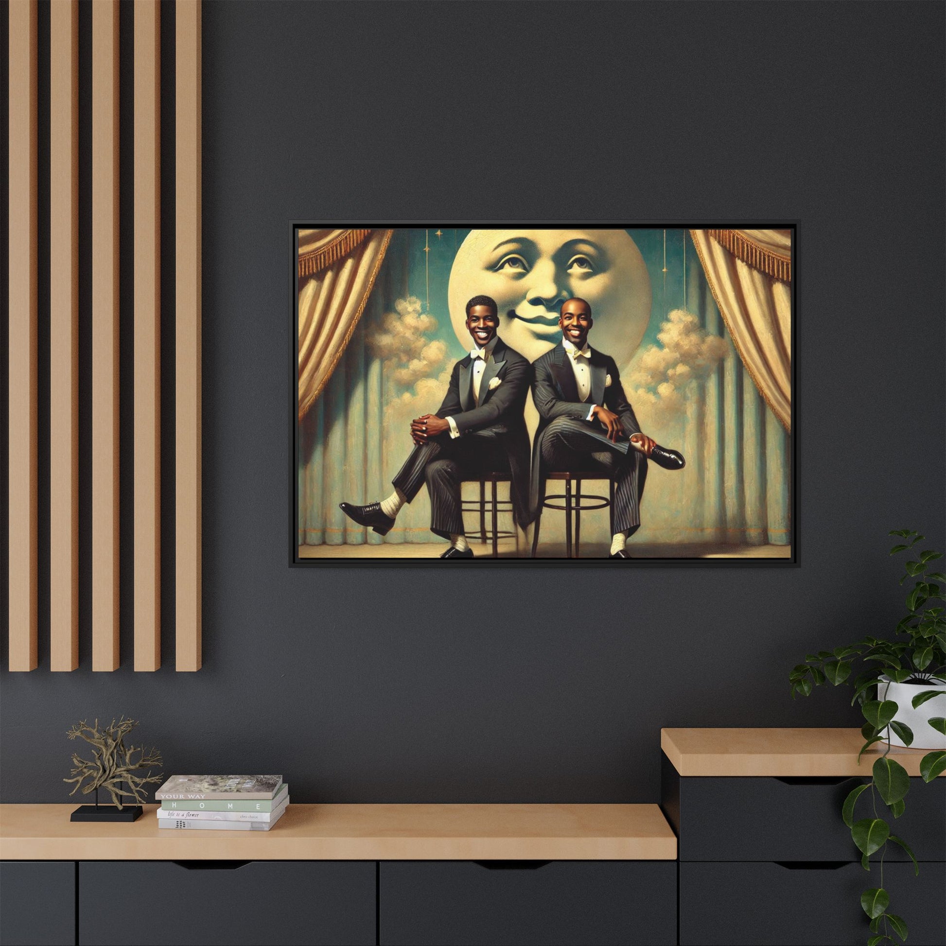 Framed vintage-style portrait of two Black men in tuxedos seated under a smiling crescent moon prop with golden curtains and cloud backdrop. This restored matte canvas honors lost LGBTQ history and reclaims early 20th-century queer representation with pride.