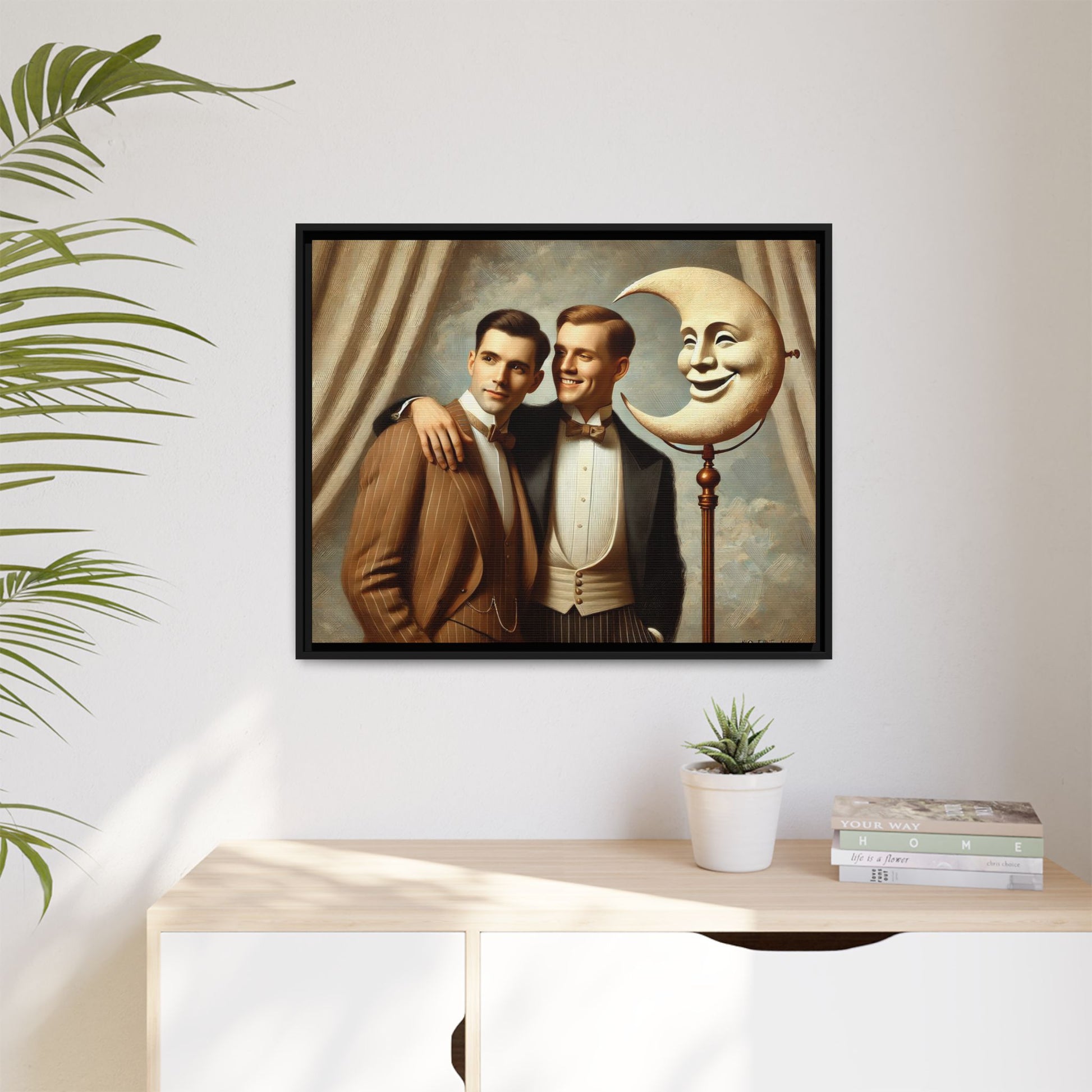 Framed matte canvas artwork of two men in vintage tuxedos standing beside a crescent moon prop. This piece reclaims LGBTQ+ representation lost to bias and honors everyday moments of affection and connection once absent from historical archives.