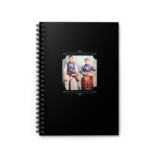 Restored early 1900s photo of two men in cowboy attire holding hands on a black spiral notebook