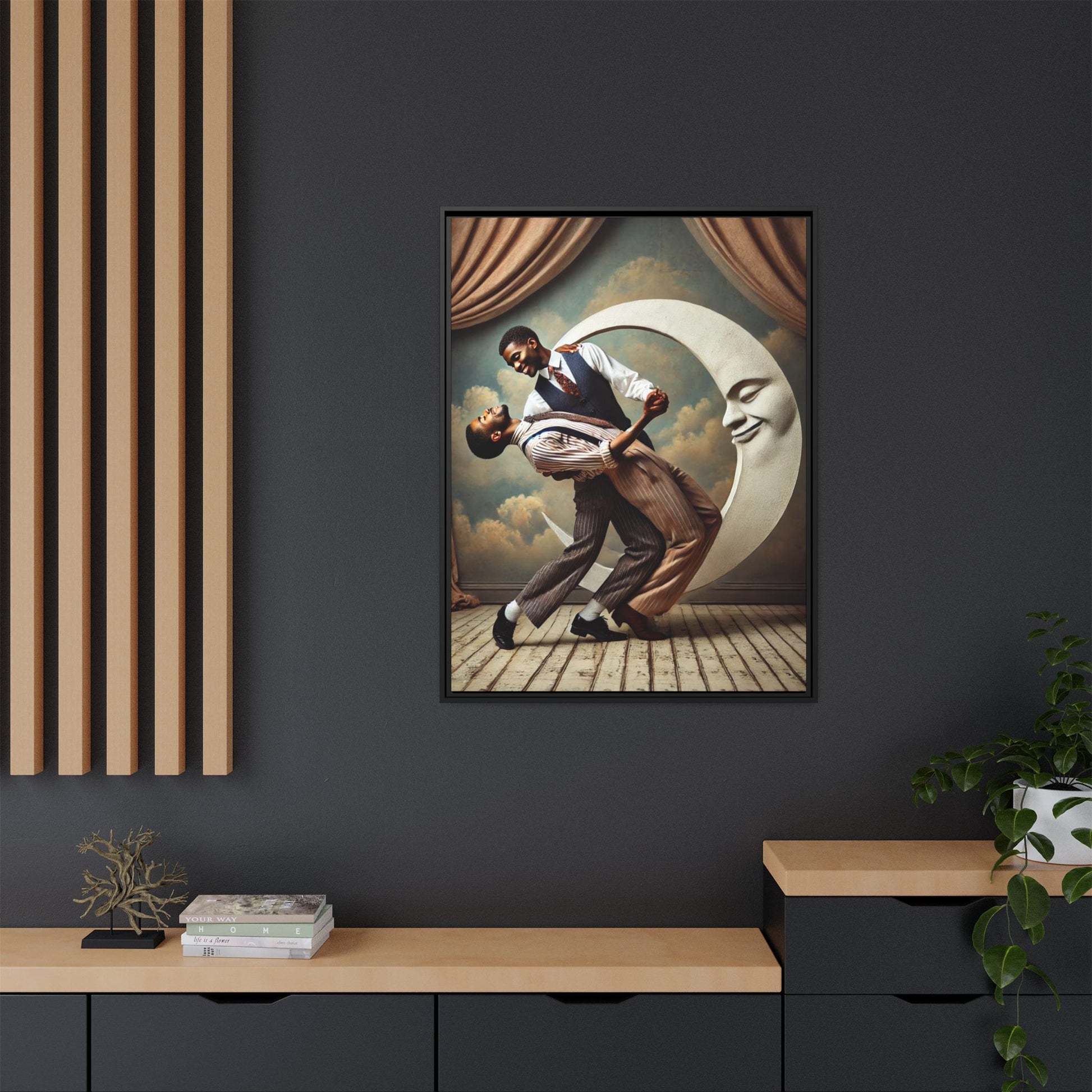 Framed artwork of two Black men in vintage suits dancing tenderly beneath a crescent moon with a smiling face. A romantic 1920s-inspired scene with velvet curtains and a painted sky backdrop. Part of a collection reclaiming lost queer Black history and art.