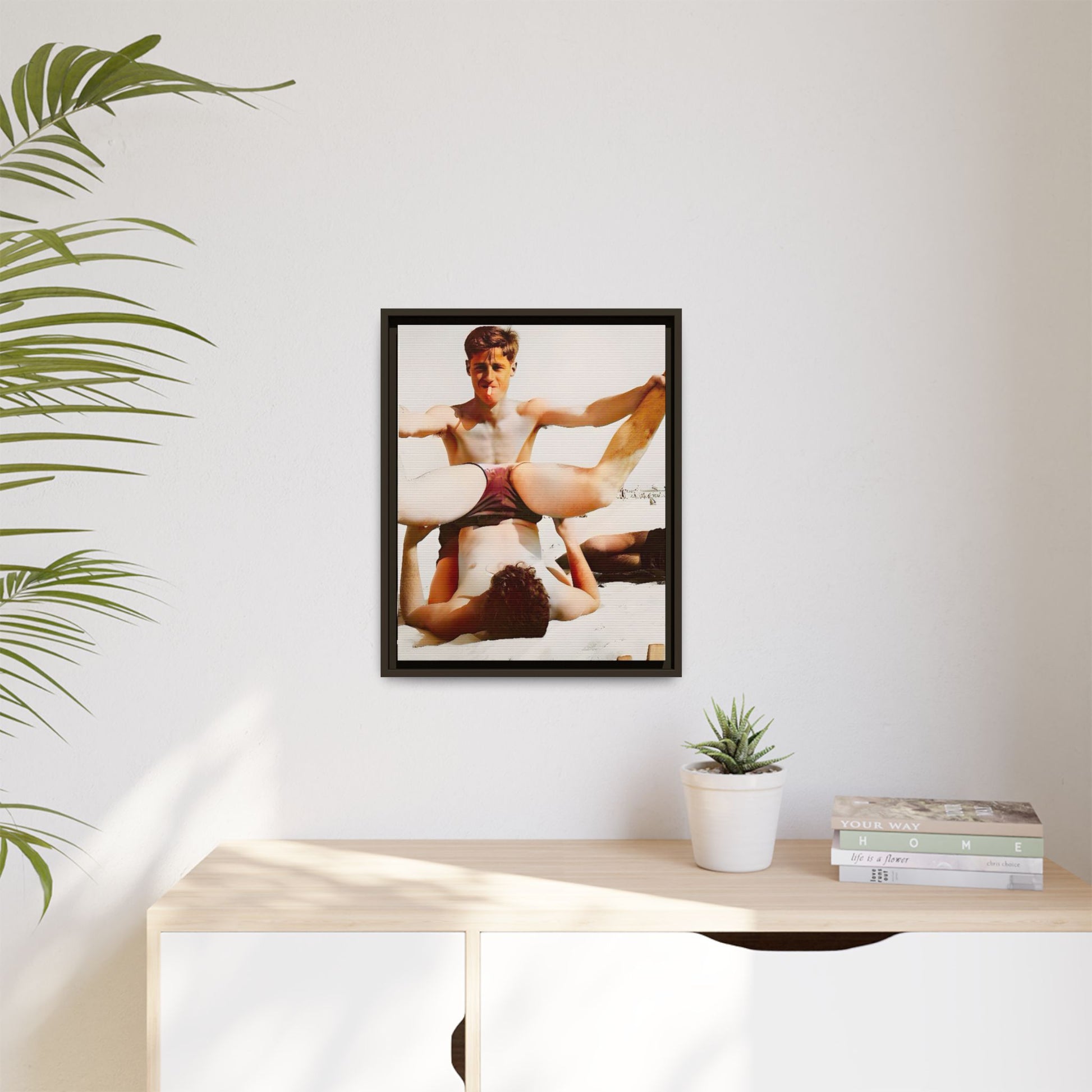 Restored mid-20th century photo of Mitch and Sam at 12th Street Beach, Miami, sharing a playful moment of love and joy, framed as wall décor.