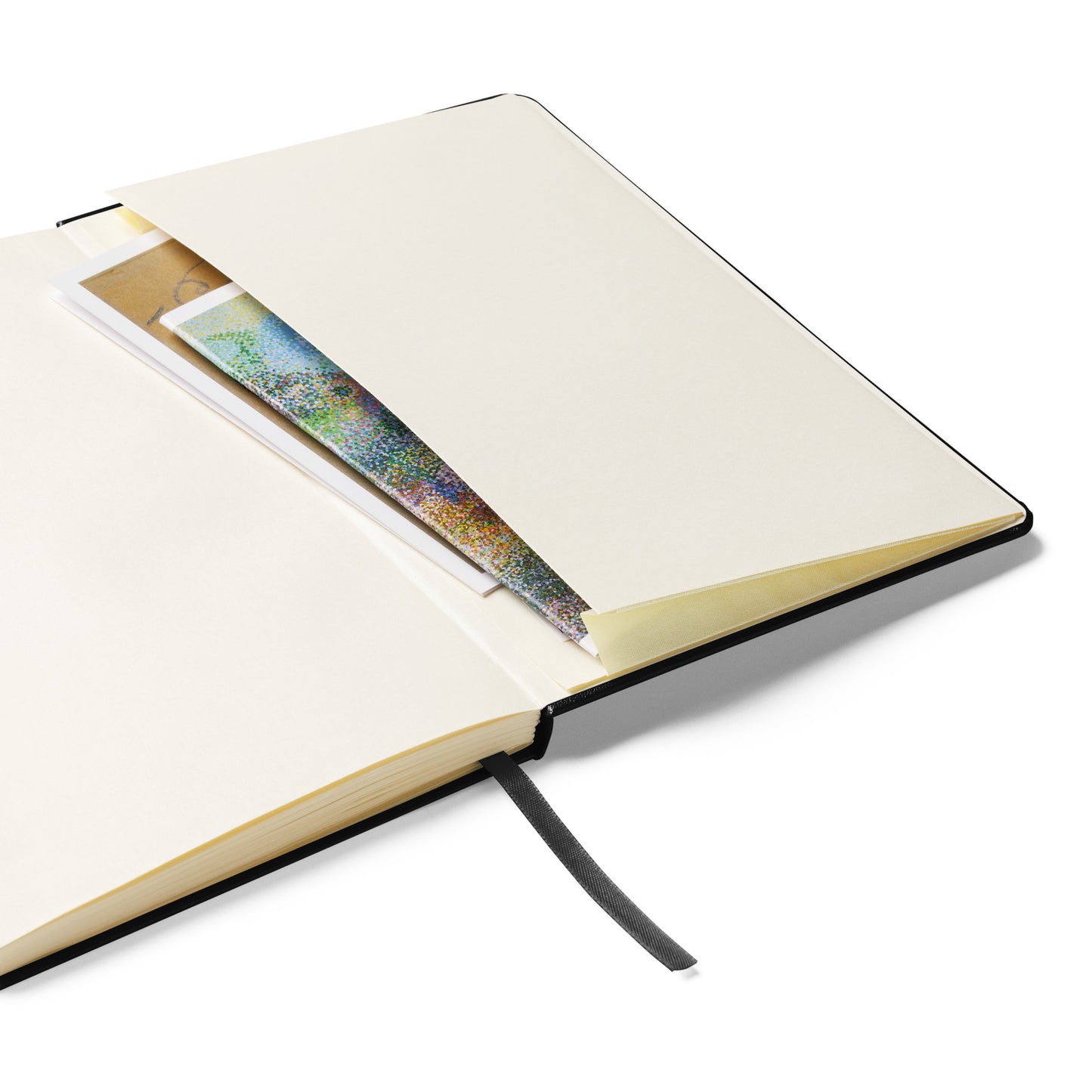 Black hardcover notebook with embedded vintage photo of two affectionate men in a forest setting.