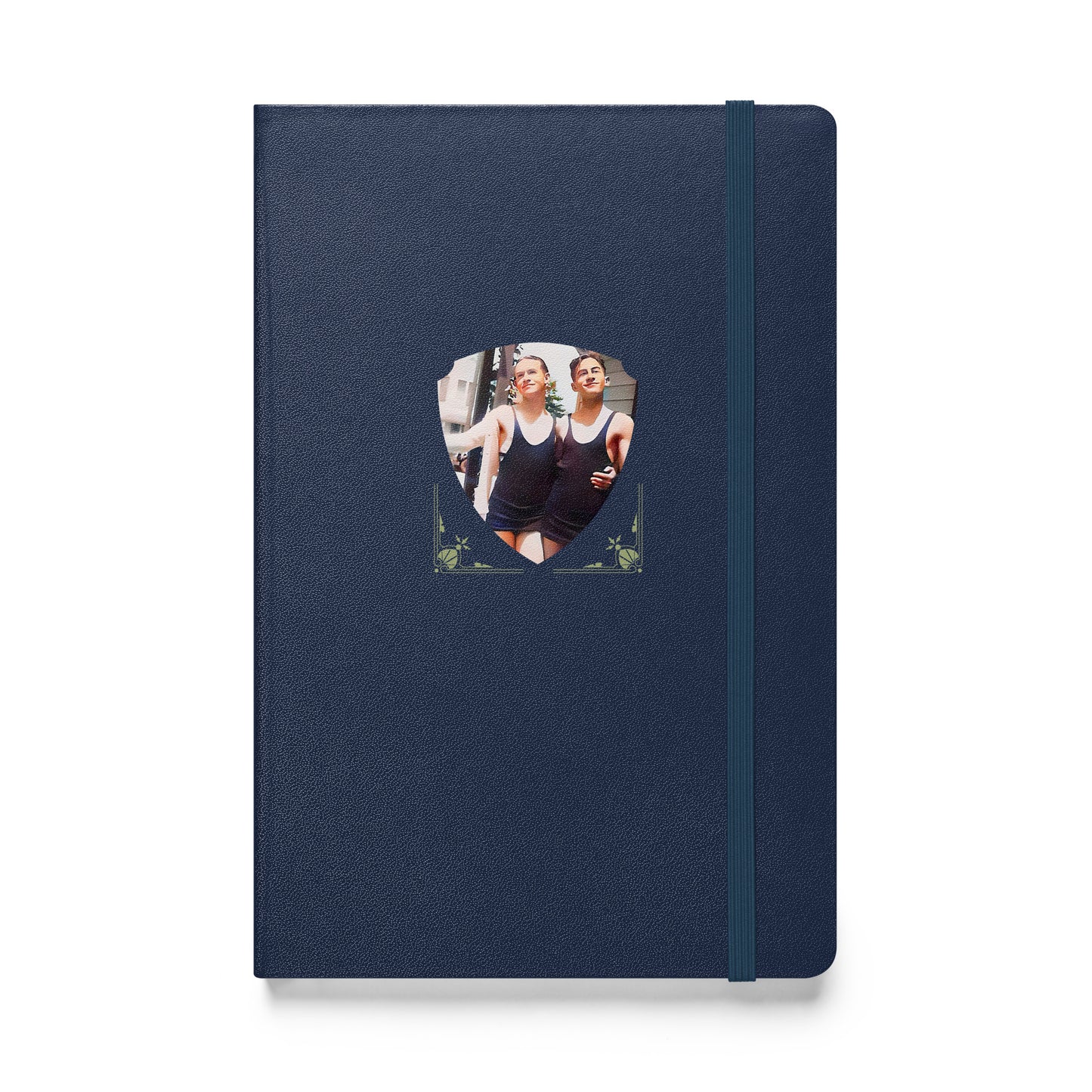 Vintage-style photo of two men in matching 1920s swimsuits walking arm in arm on the front of a black notebook.