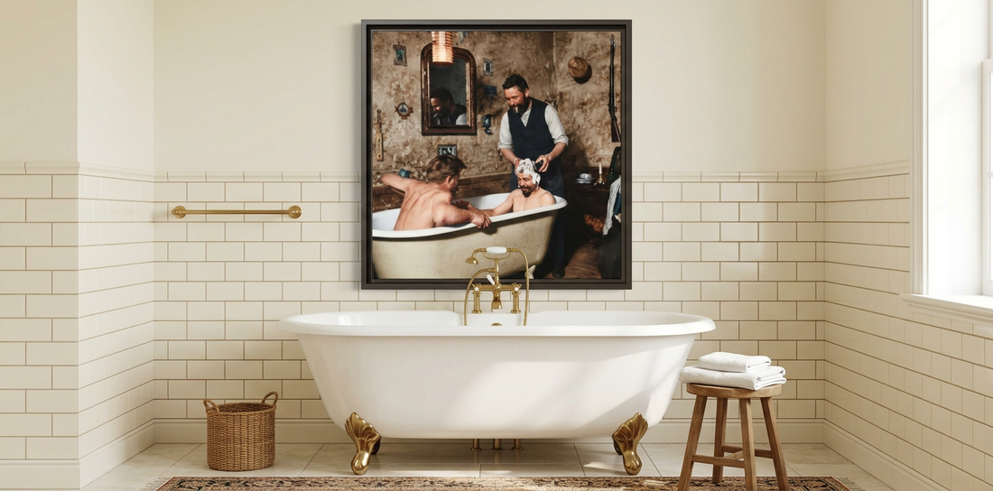 Framed vintage photograph of three men sharing a bathing moment above a white clawfoot tub in an ivory tiled bathroom with brass fixtures.