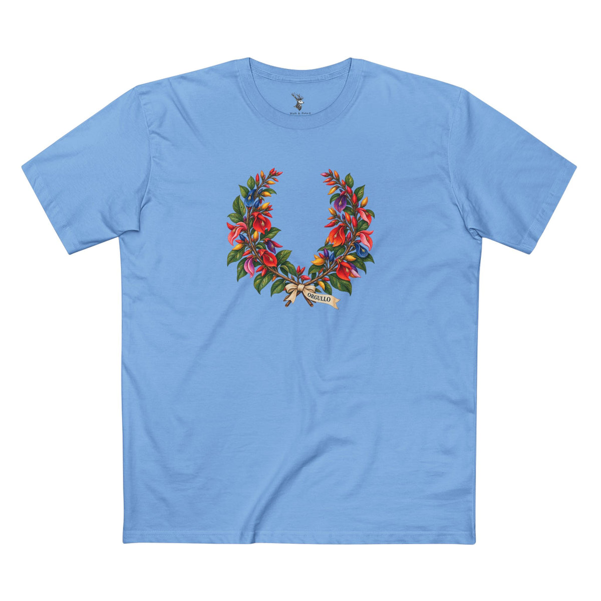 Light T-shirt featuring a ceibo botanical crown with multicolored flowers, muted green foliage, and black ORGULLO lettering beneath the crossed stems.