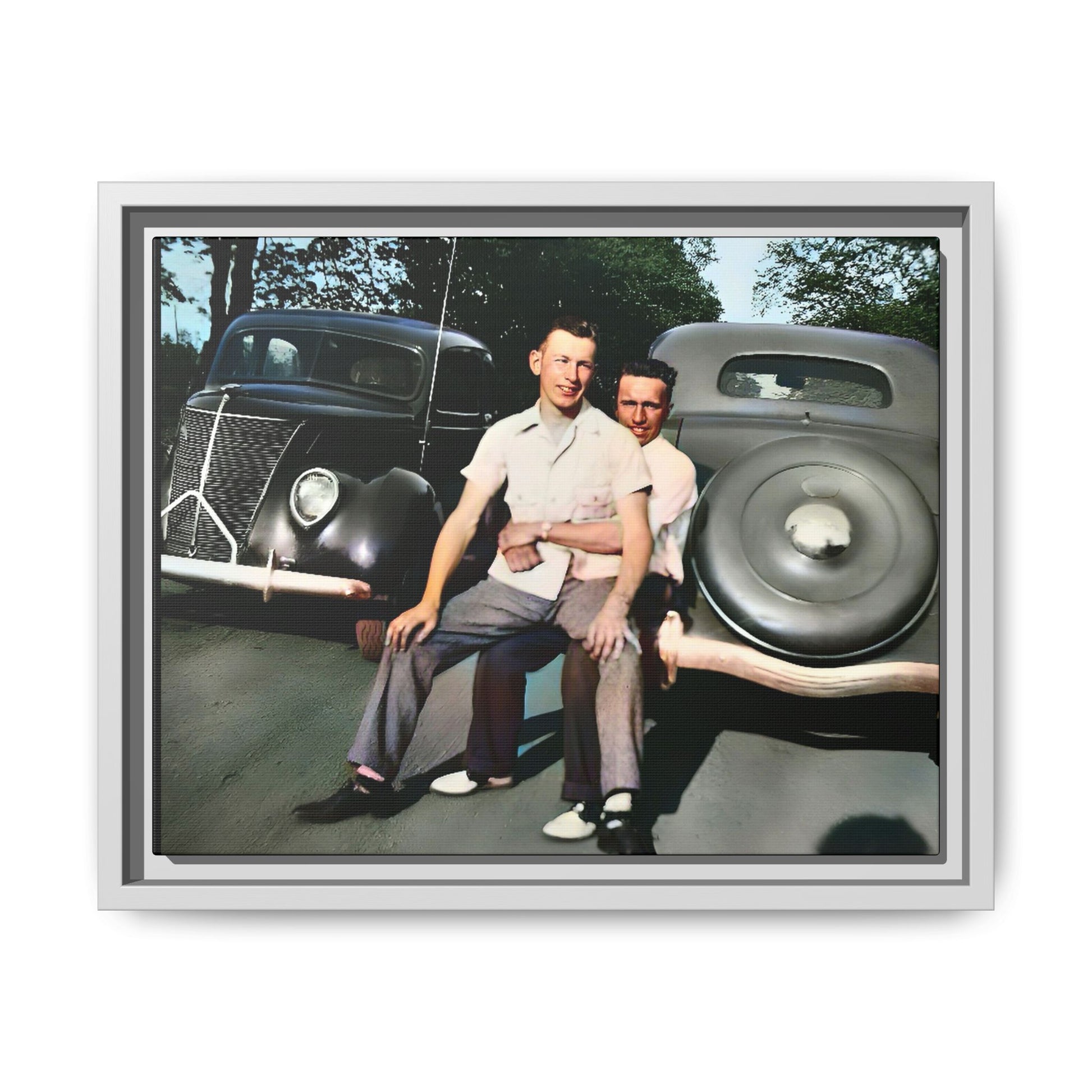 Restored 1930s vintage photo of Andrew and Eugene seated on a classic car bumper in Lincoln, Nebraska. Framed matte canvas art celebrating LGBTQ+ history, love, and timeless companionship.