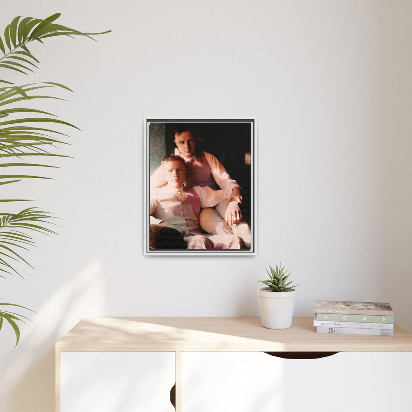 Restored vintage photograph of James and Henry, an early 1900s LGBTQ+ couple from Dayton, Ohio, sharing an intimate, sunlit moment. Framed matte canvas print celebrating love, devotion, and LGBTQ+ history.