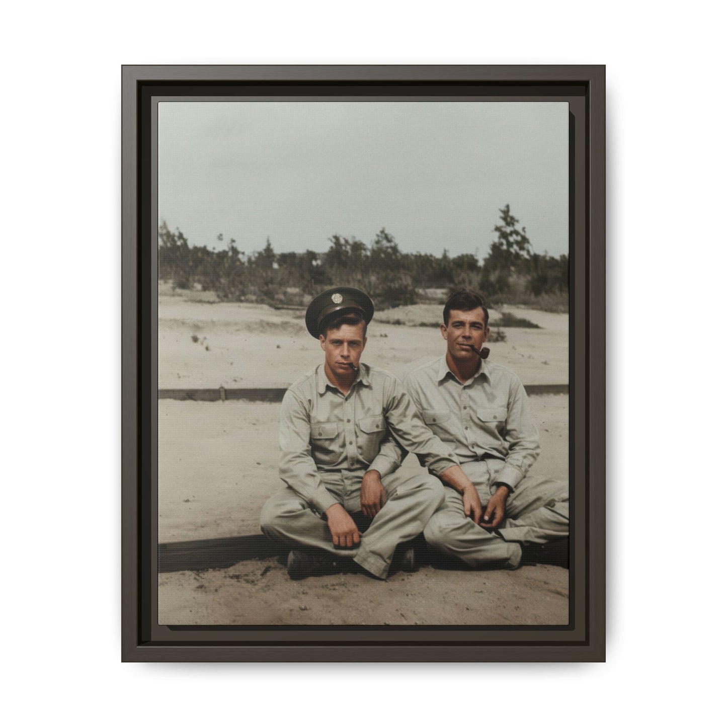 Historical seated portrait showing two casually dressed figures outdoors, one with a cap and both smoking