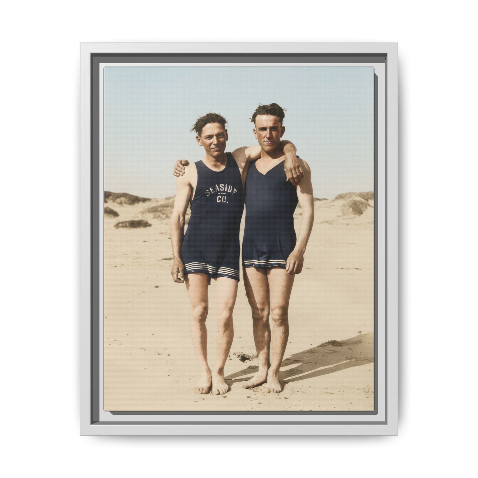 Vintage beach portrait with two barefoot figures against sand dunes and sky 