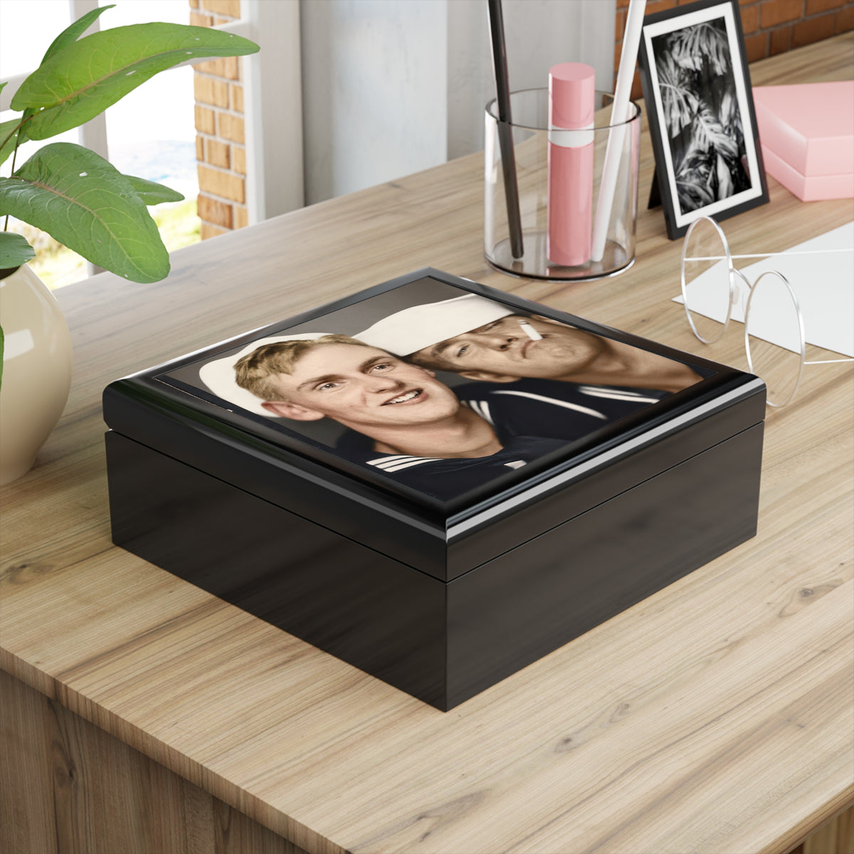 Angled wooden keepsake box with vintage photobooth image of two sailors in white caps, one smiling and the other holding a cigarette.