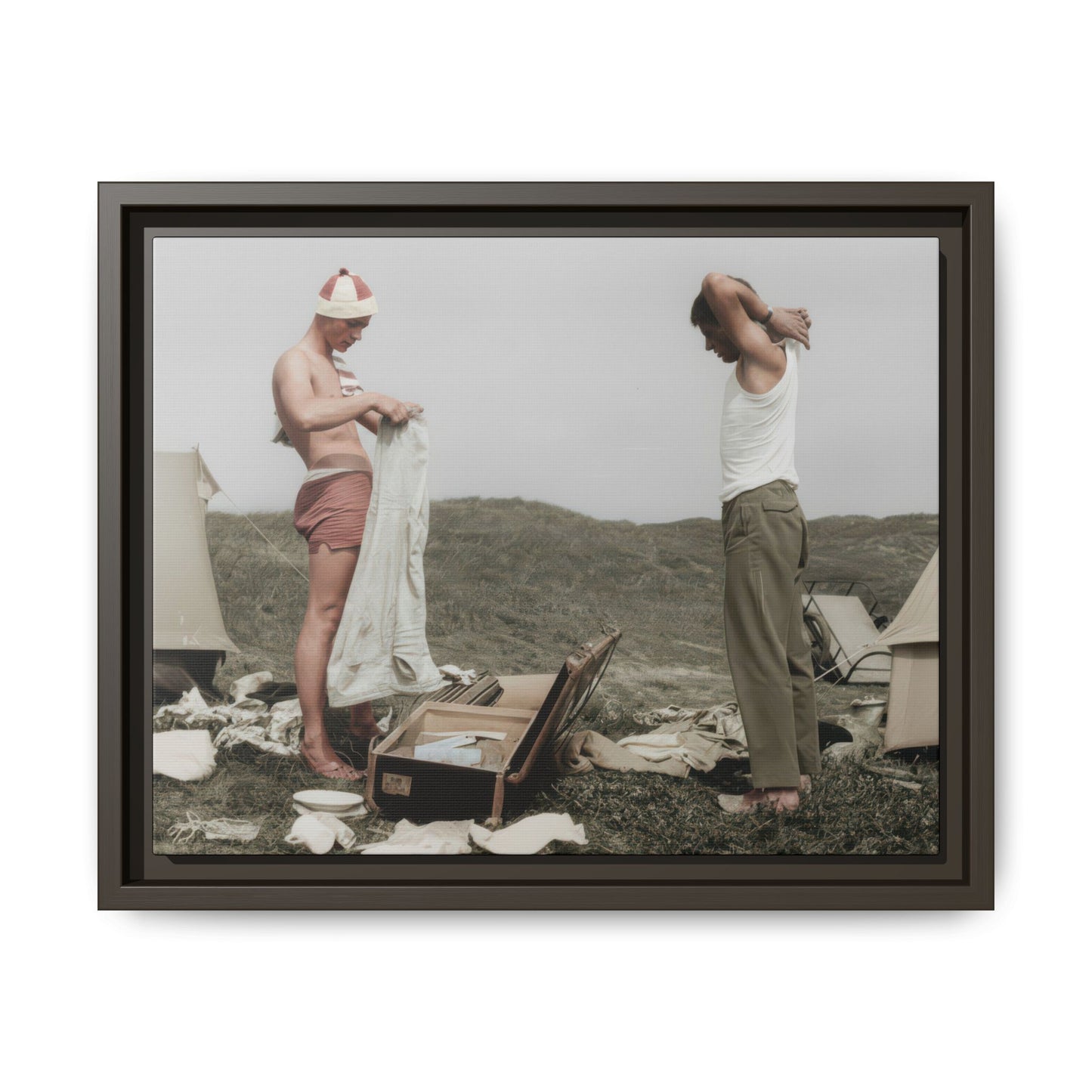 Vintage outdoor double portrait with tents, luggage, and two men in an informal camp scene