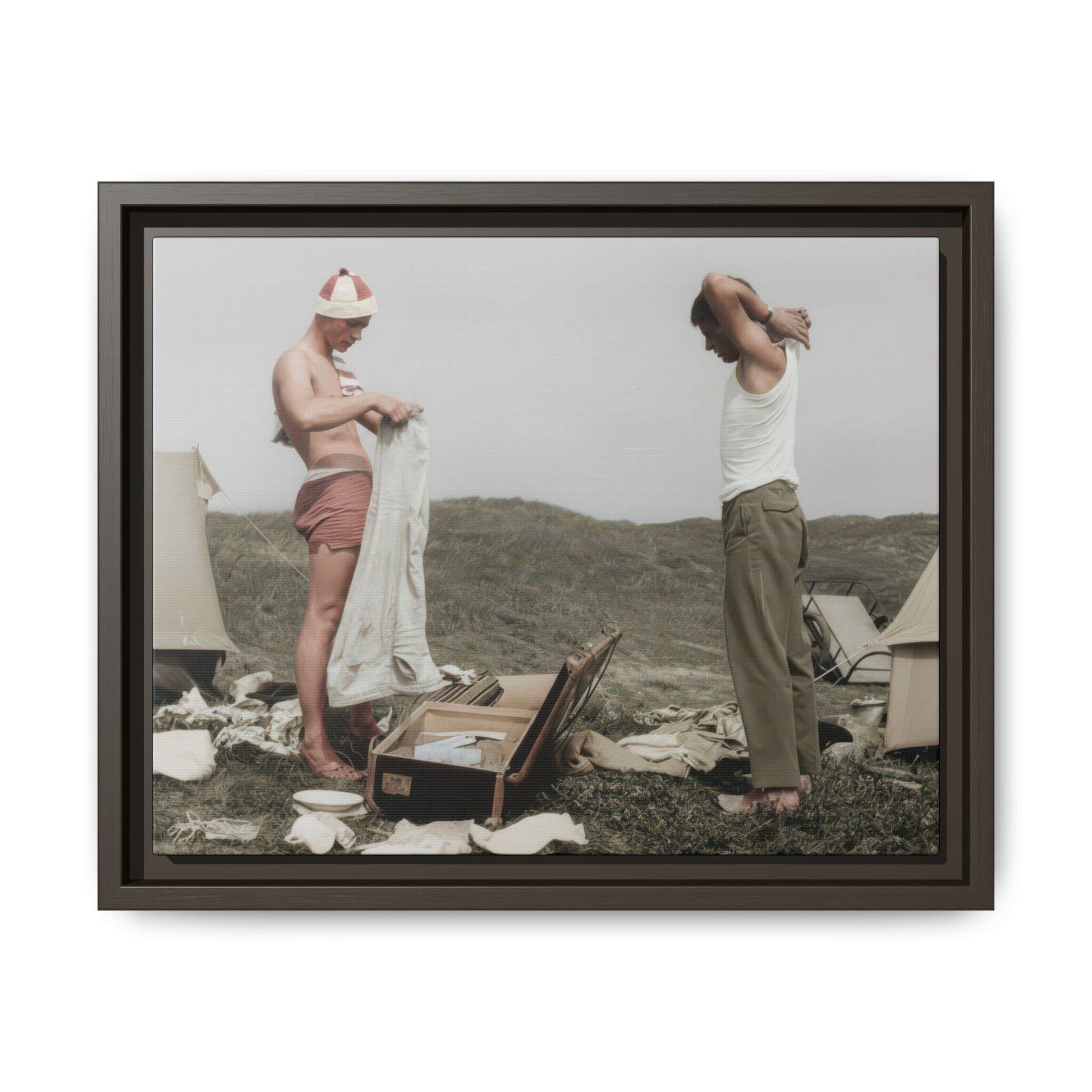 Vintage outdoor double portrait with tents, luggage, and two men in an informal camp scene