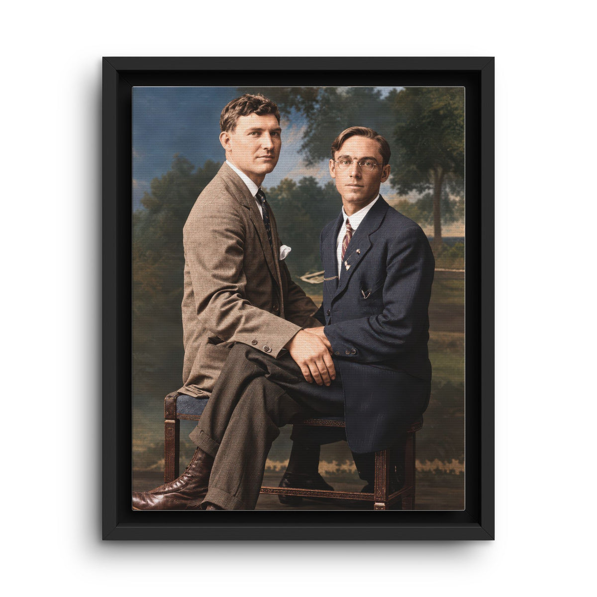 Paire 165 vintage studio portrait of two men in suits seated together on an ornate wooden bench.
