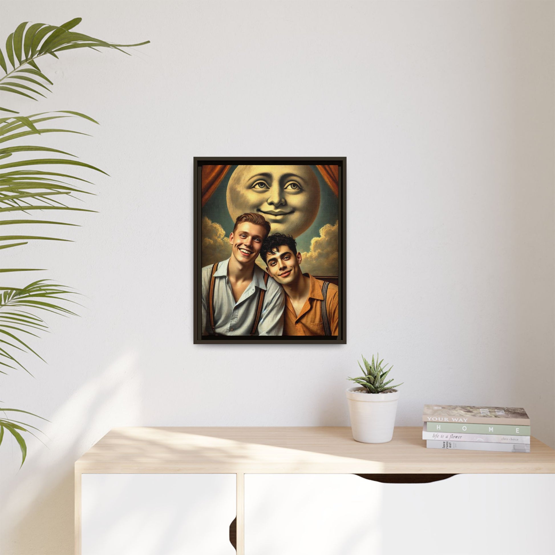 Framed artwork featuring a joyful queer couple in 1930s attire, seated close together beneath a smiling full moon in a theatrical studio setting. A celebration of reclaimed LGBTQ+ narratives in nostalgic portraiture.