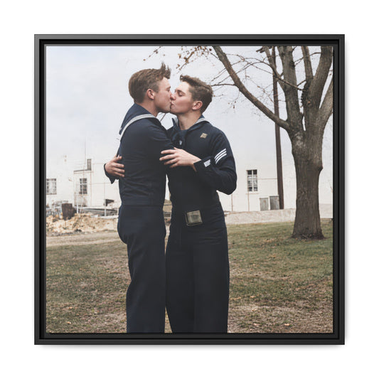Historical image of two sailors embracing beneath a leafless tree with a pale building in the background.